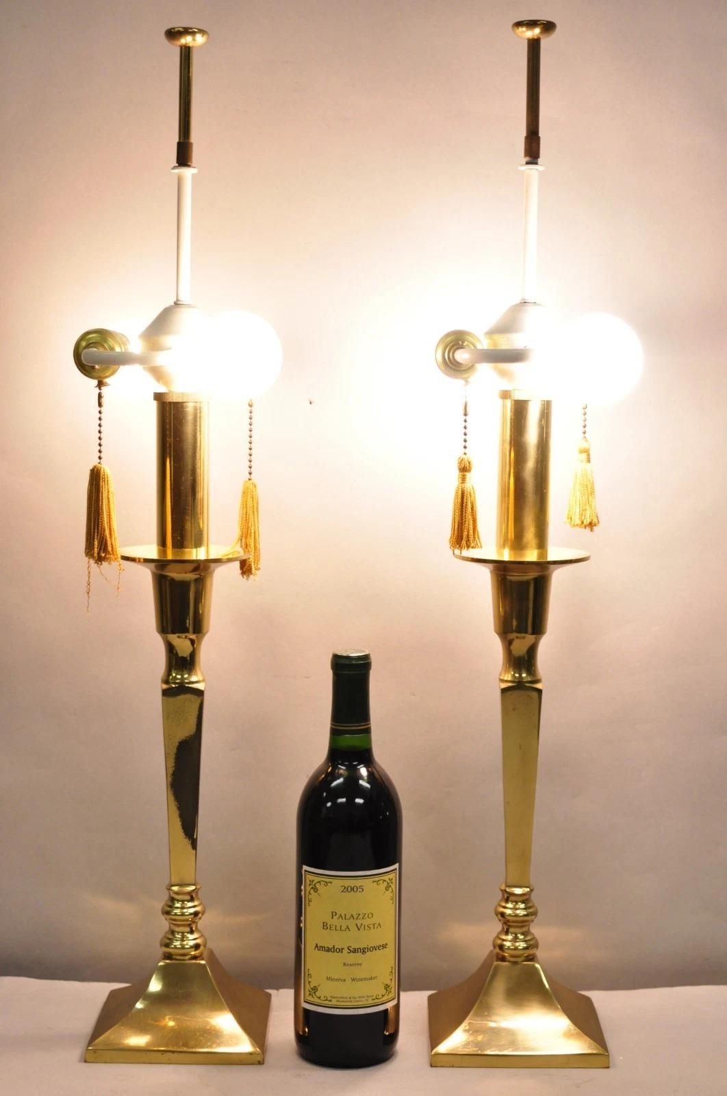 Vintage Hollywood Regency Tommi Parzinger Style Brass Lacquered Candlestick Table Lamps - a Pair. Circa Late 20th Century. Dimensions : 28,5