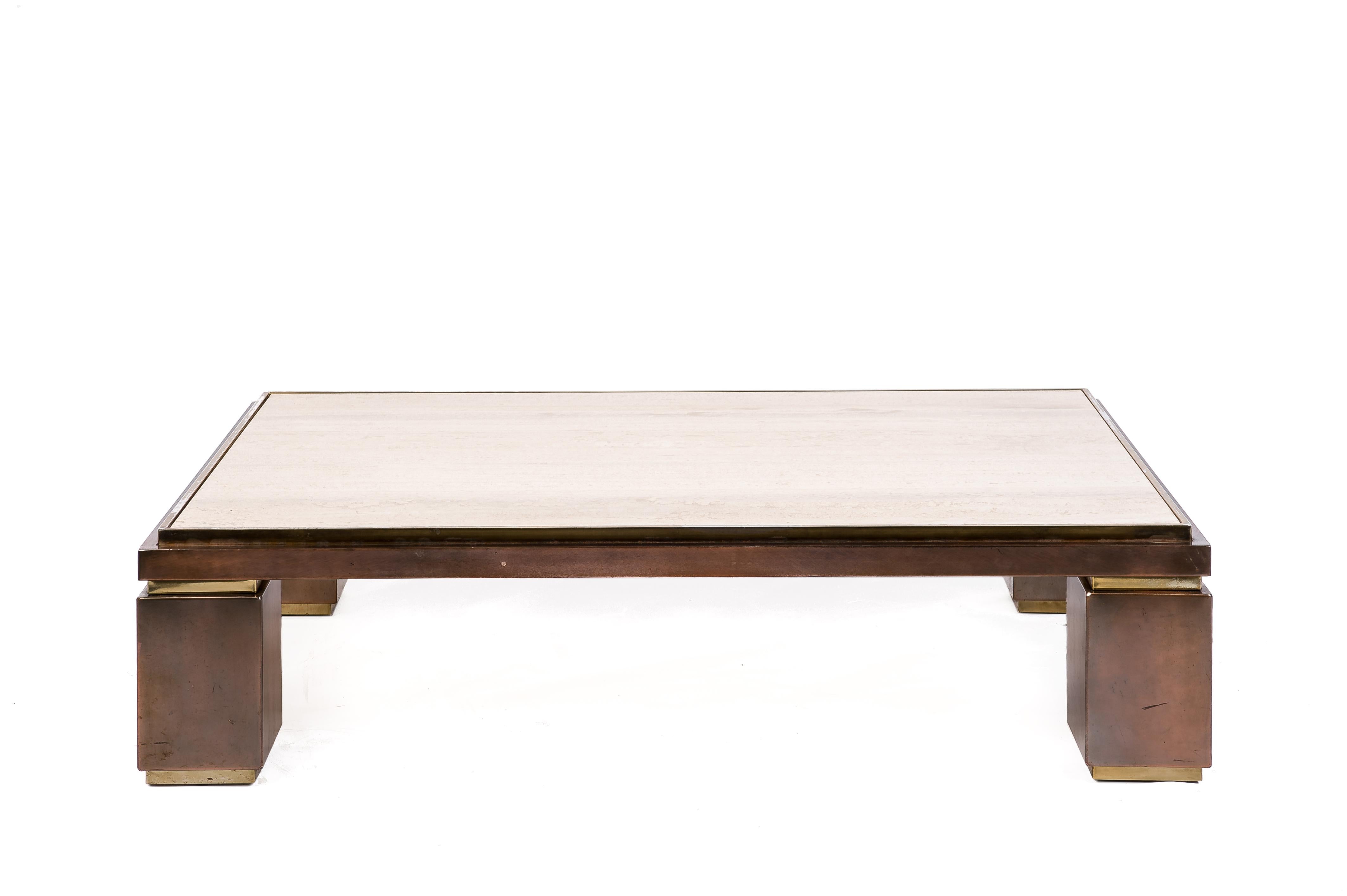 A very special Belgo Chrome sculptural coffee table with a solid travertine top on a bi-color brass base finished with chrome, copper, and brass. This table was made in Belgium in the late 1970s. The Belgian company Belgo Chrom was known for its
