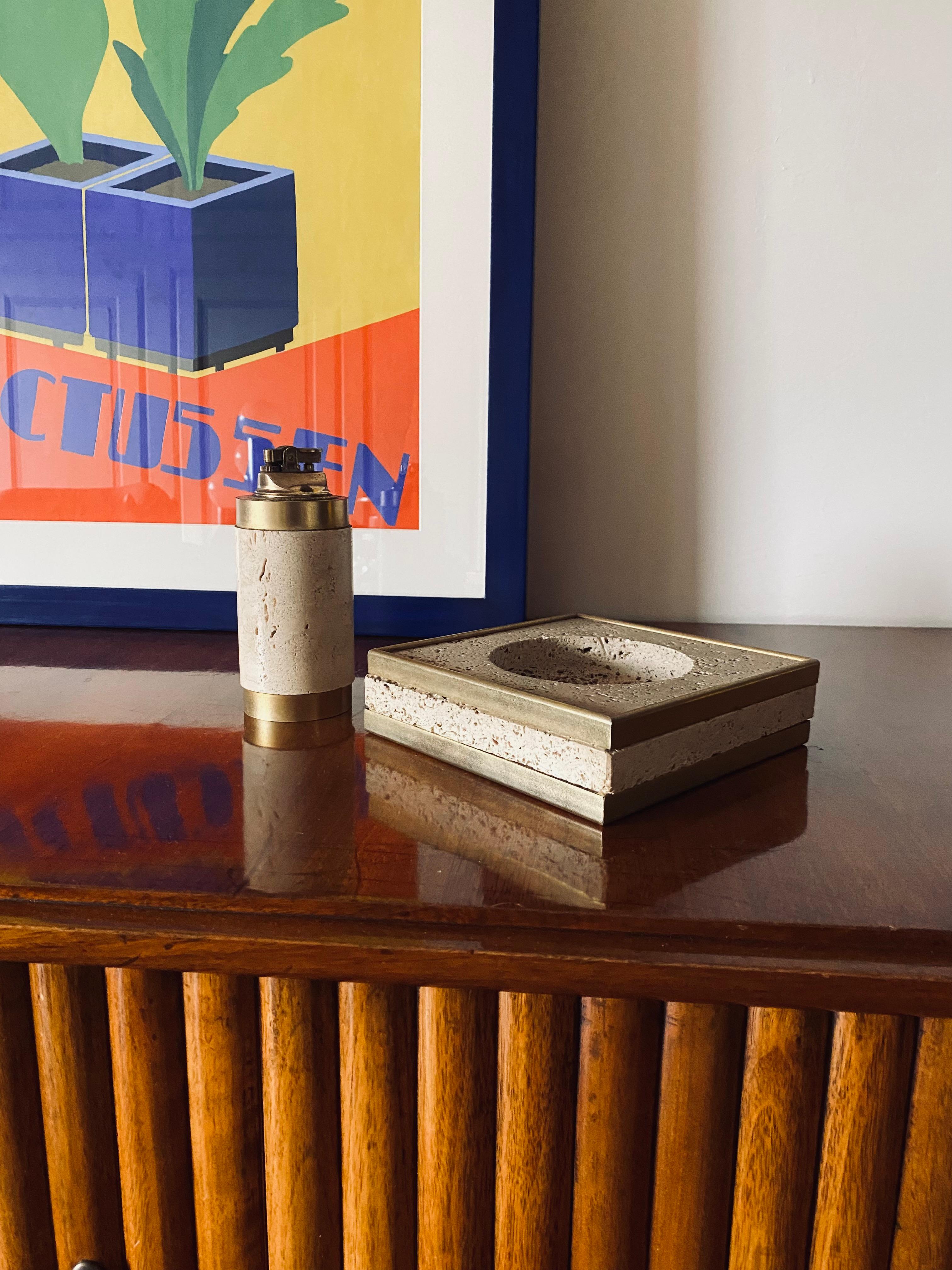 Hollywood regency smoking set, ashtray and table lighter

Cerri Nestore, Italy ca. 1970

Brass, travertine

Ashtray: H 4.5 x 16.5 x 16.5 cm

Table lighter: H 15.5 x 7 x 7 cm

Conditions: excellent consistent with age and use.