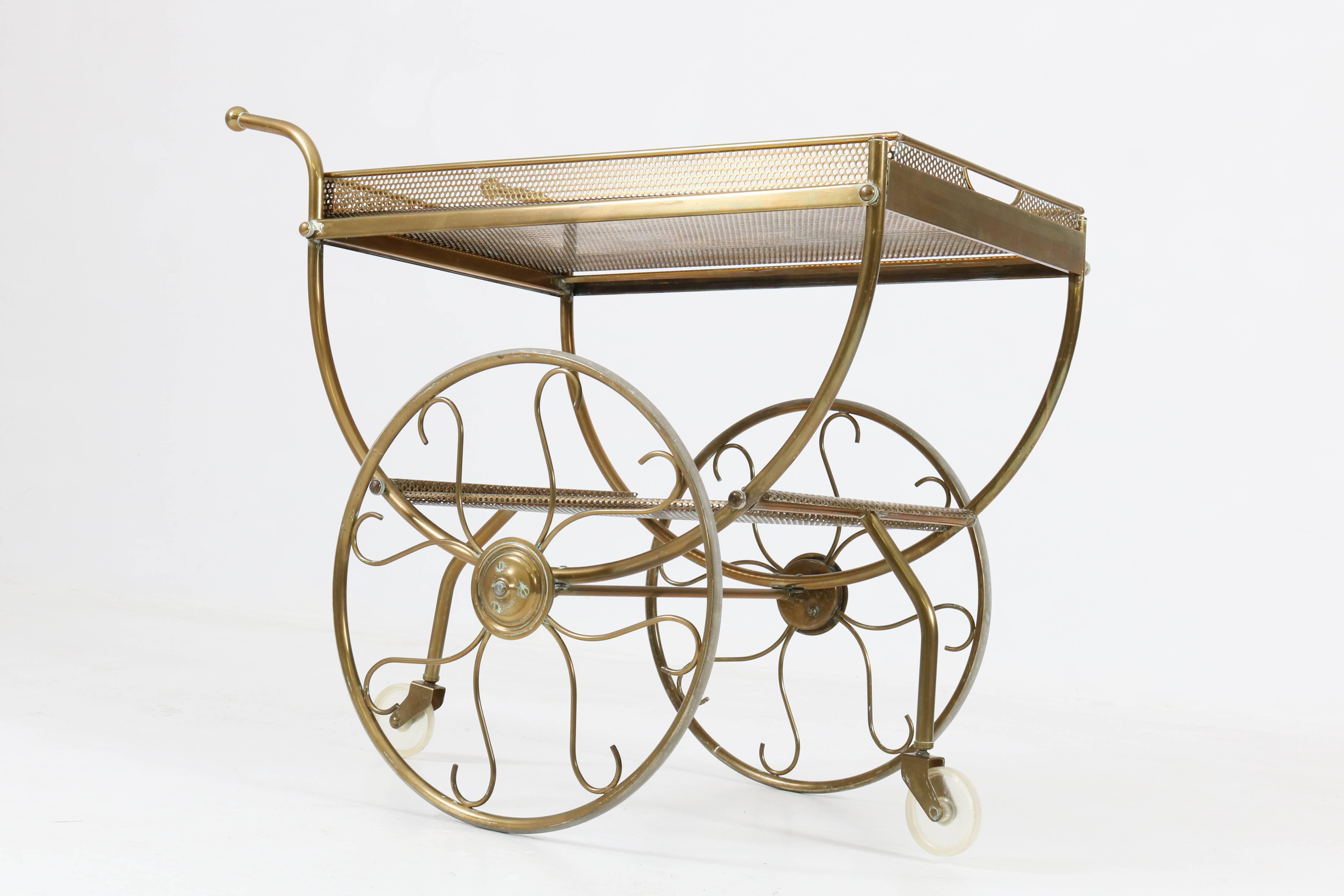 Hollywood Regency trolley or bar cart by Josef Frank for Svenskt Tenn Sweden, 1950s.
Tubular and perforated brass with original wheels.
In good original condition with minor wear consistent with age and use,
preserving a beautiful patina.