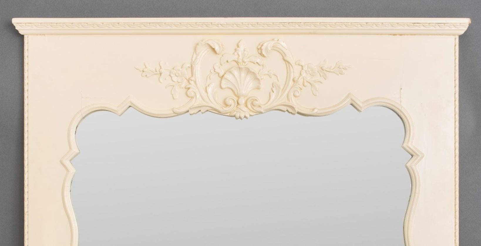 Hollywood Regency painted trumeau wall mirror with scrolls and shell cartouche crest.

Dimensions: 50