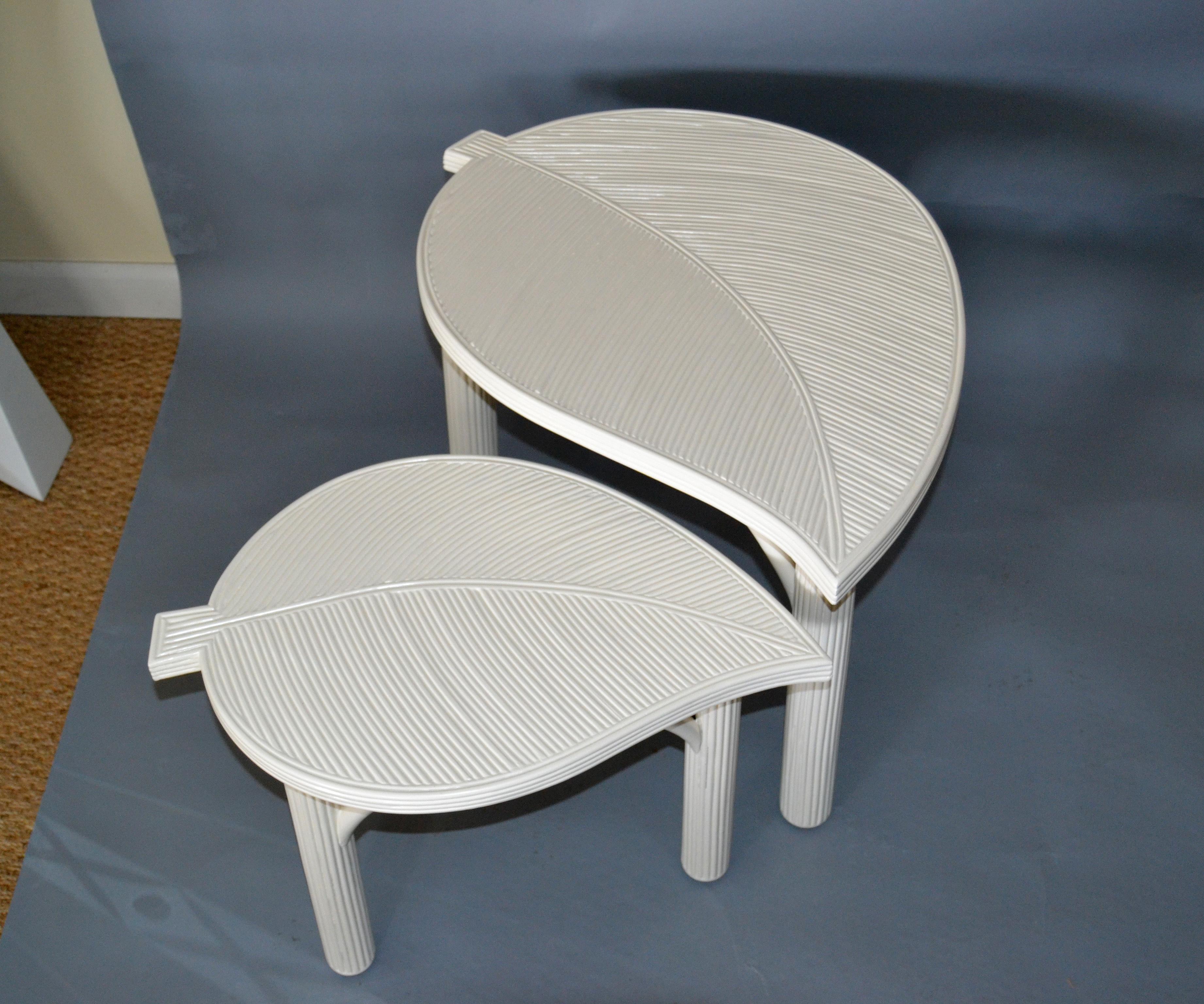 Two off white or beige Hollywood Regency decorative leaf shaped bamboo and pencil reed side tables.
Made by Sandtown Furnishing Inc. in the Philippines.
Sturdy and made with great craftsmanship.
Super addition to Your Sunroom and Florida House.