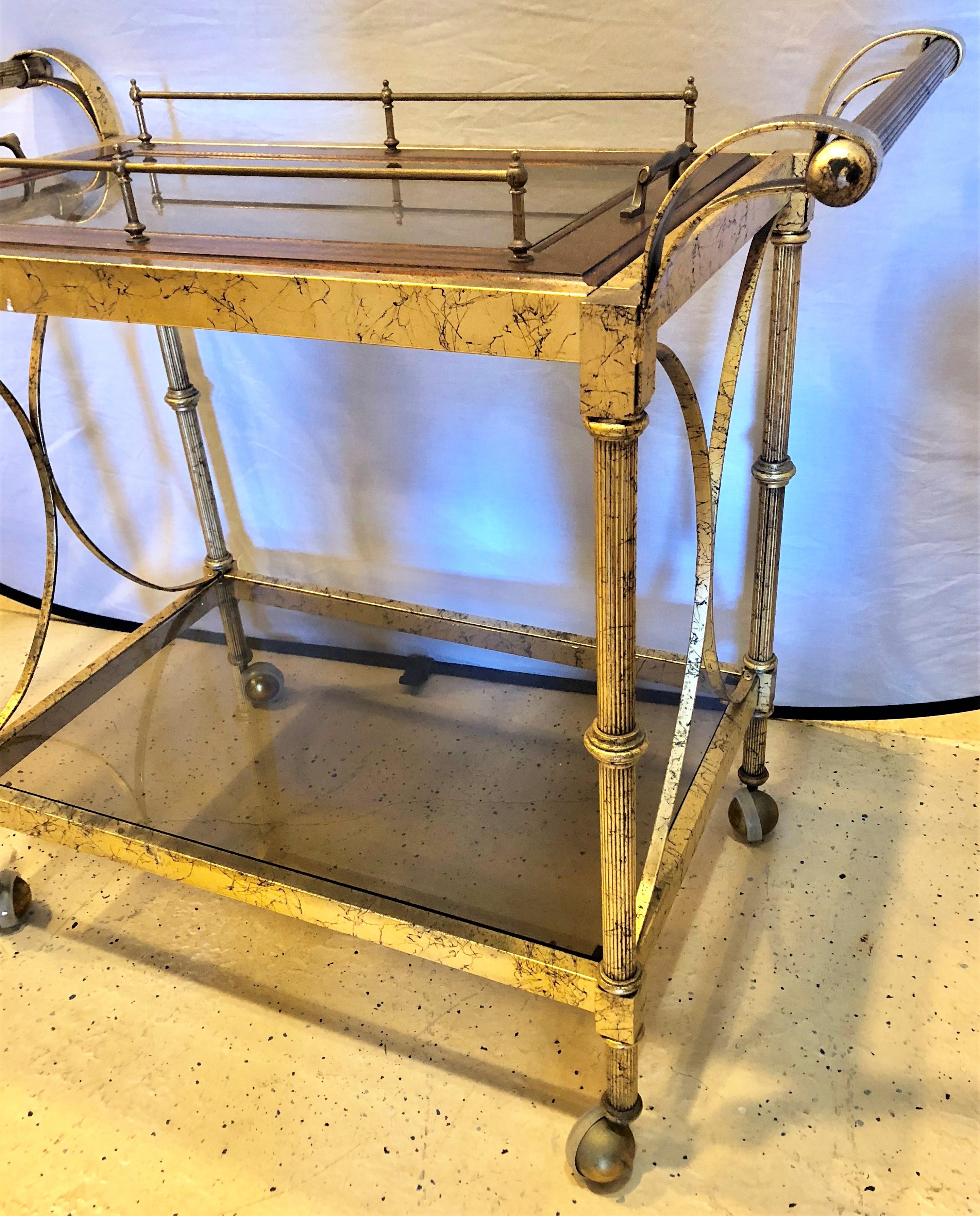 A Hollywood Regency two-tier serving cart faux finish marbleized.