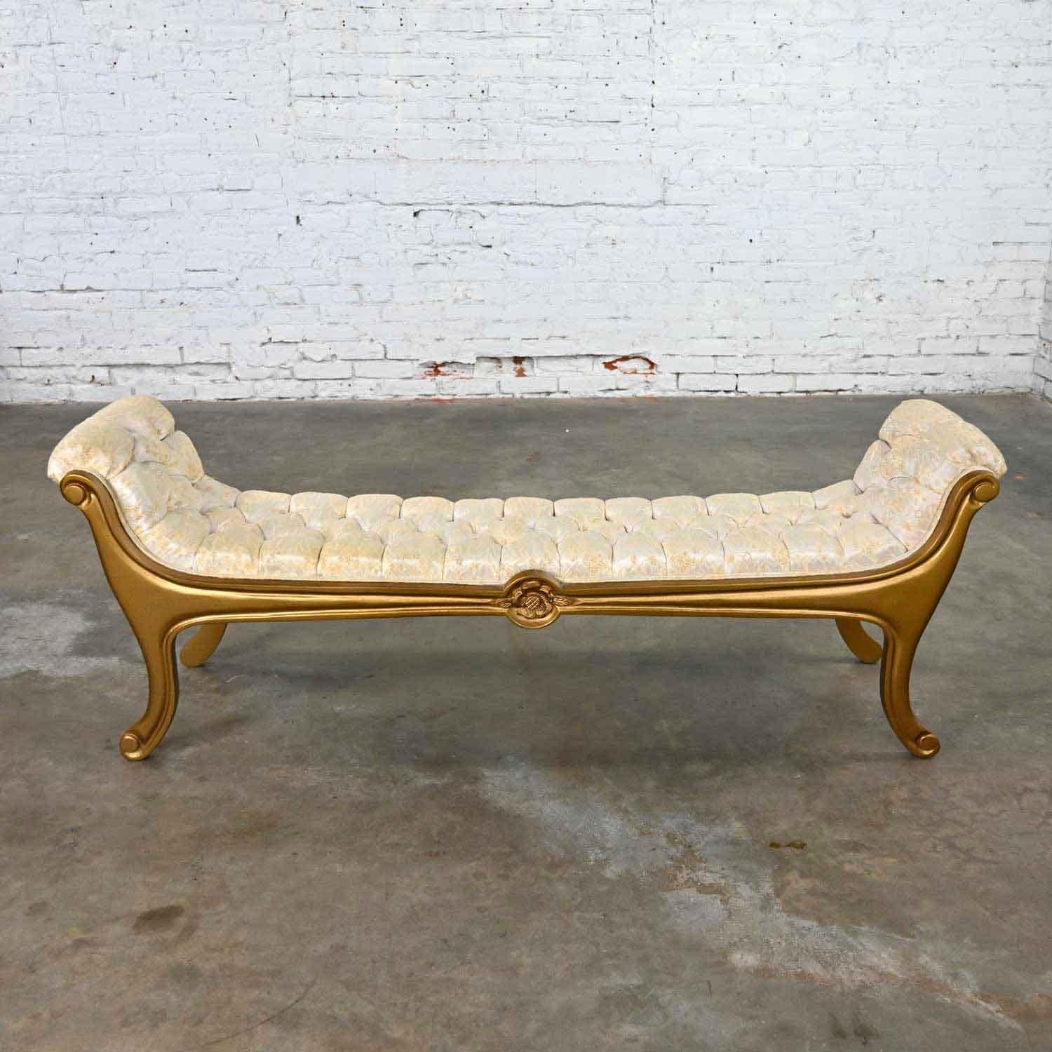 Phenomenal Hollywood Regency or French Provincial upholstered gilded gondola bench attributed to Prince Howard Furniture. Original beige and golden brocade fabric and giltwood finish. Beautiful condition, keeping in mind that this is vintage and not