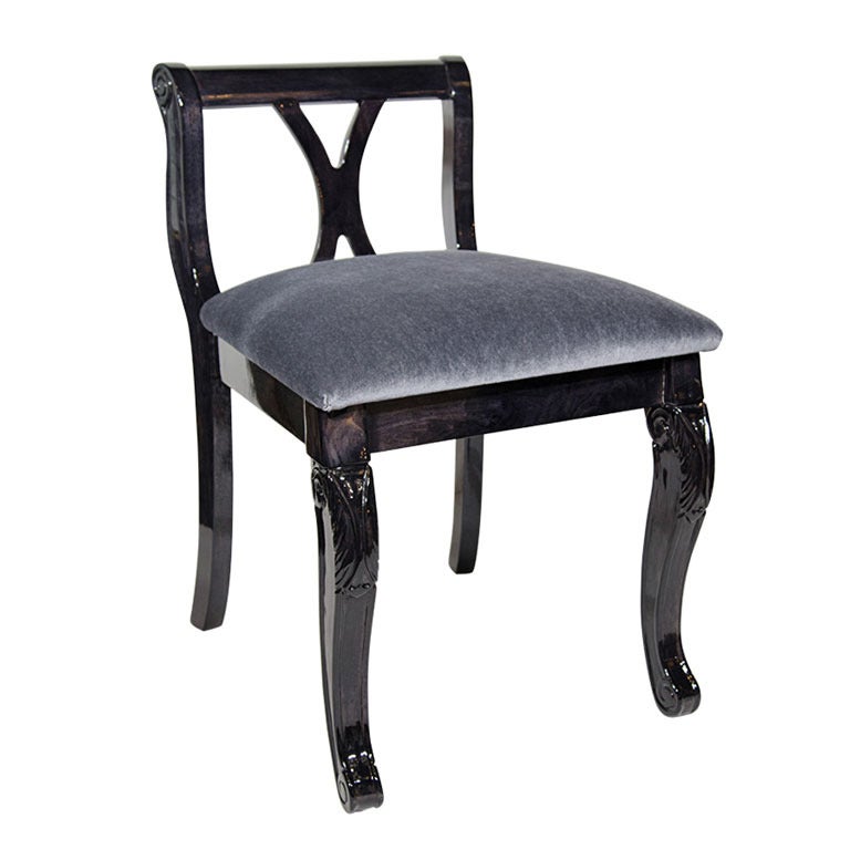 Elegant Art Deco era vanity stool or side chair, in ebonized walnut wood with charcoal gray mohair. Low back design with cabriole legs with hand carved details. Also features beautiful curved cross back with X-form. Two stools available and sold