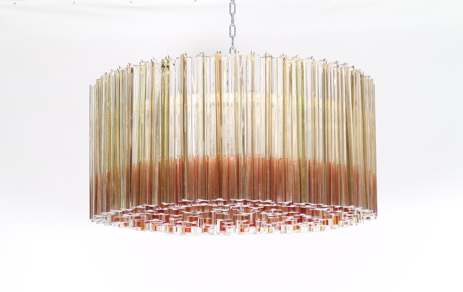 Italian Hollywood Regency Murano chandelier by Venini with Sommerso Trilobo glass rods in amber and clear glass.
The piece was made during the 1950s in Italy and has been fully restored with all new wiring and sockets. In good vintage condition