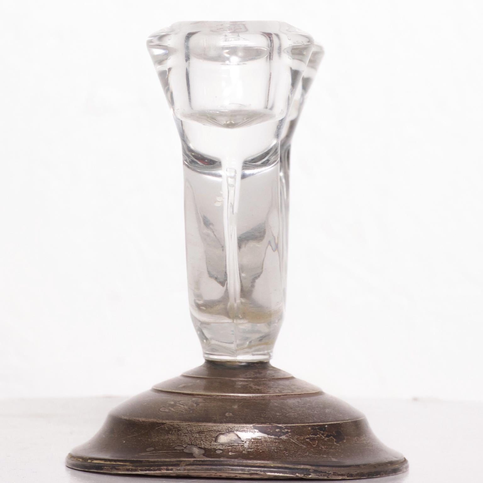 We are pleased to offer for your consideration a vintage candleholder or candlestick made by W M Rogers. The base is made of sterling silver and the top section is made of glass. Made in the USA circa 1960s. Dimensions: 5
