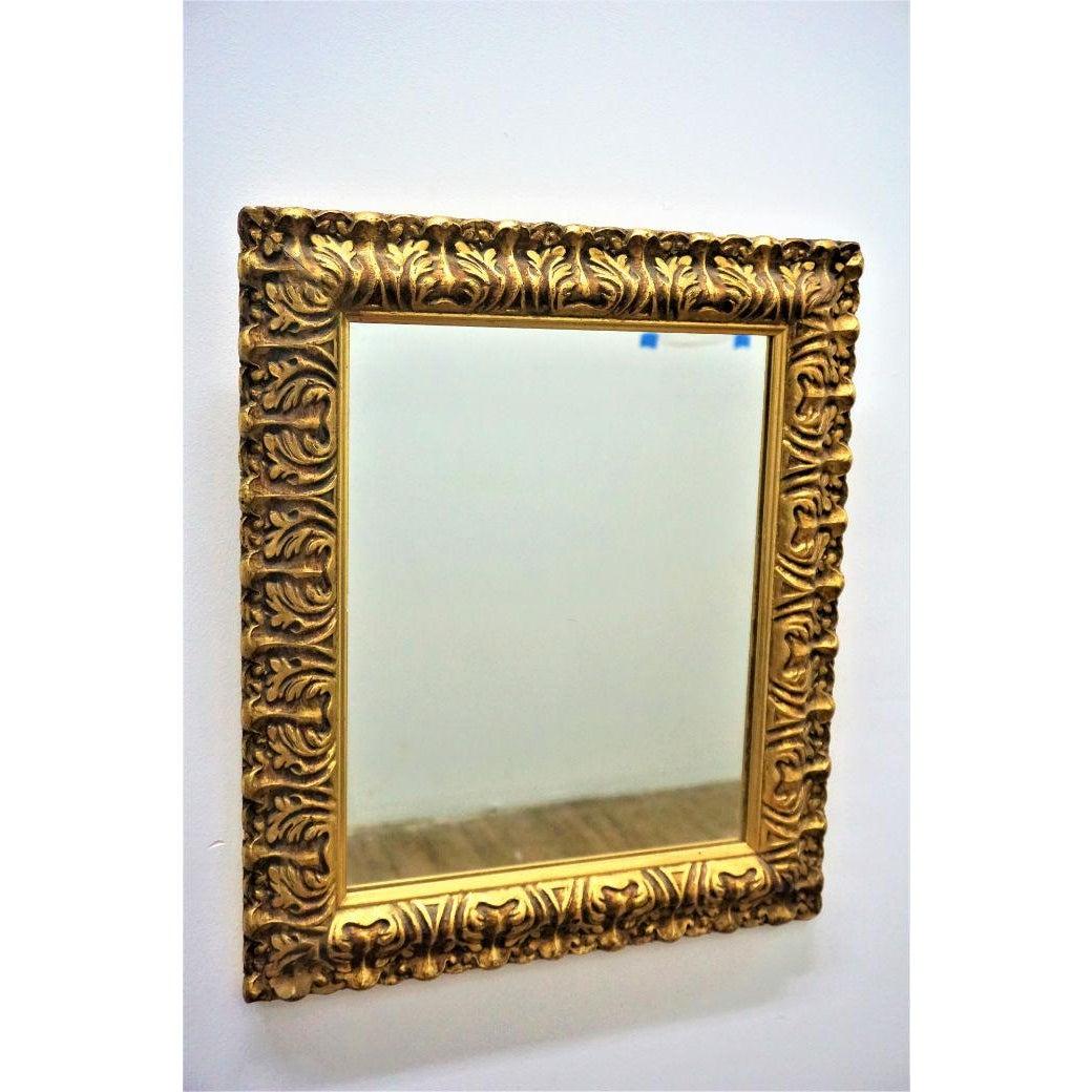 With its sophisticated and elegant golden carved frame, this Hollywood Regency gilded wall or vanity mirror is a perfect addition to any living environment. 

Dimension: 
With frame: 20.75