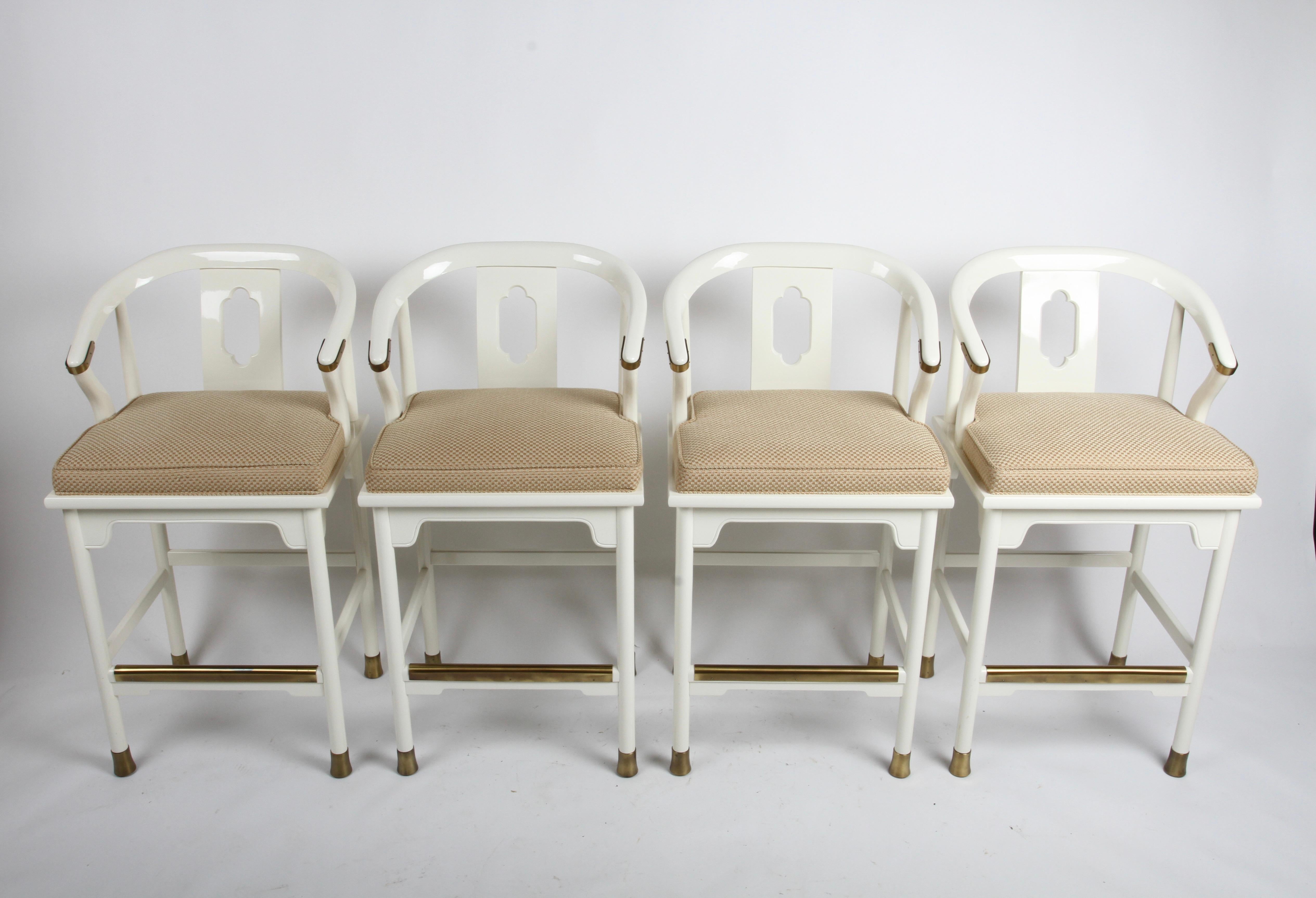 Hollywood Regency Style or Modern Ming Style set of four bar stools in white lacquer & brass details by Century Furniture Company. These stools are less common that the lounge chair version, often attributed to Mid-Century Modern Designer James