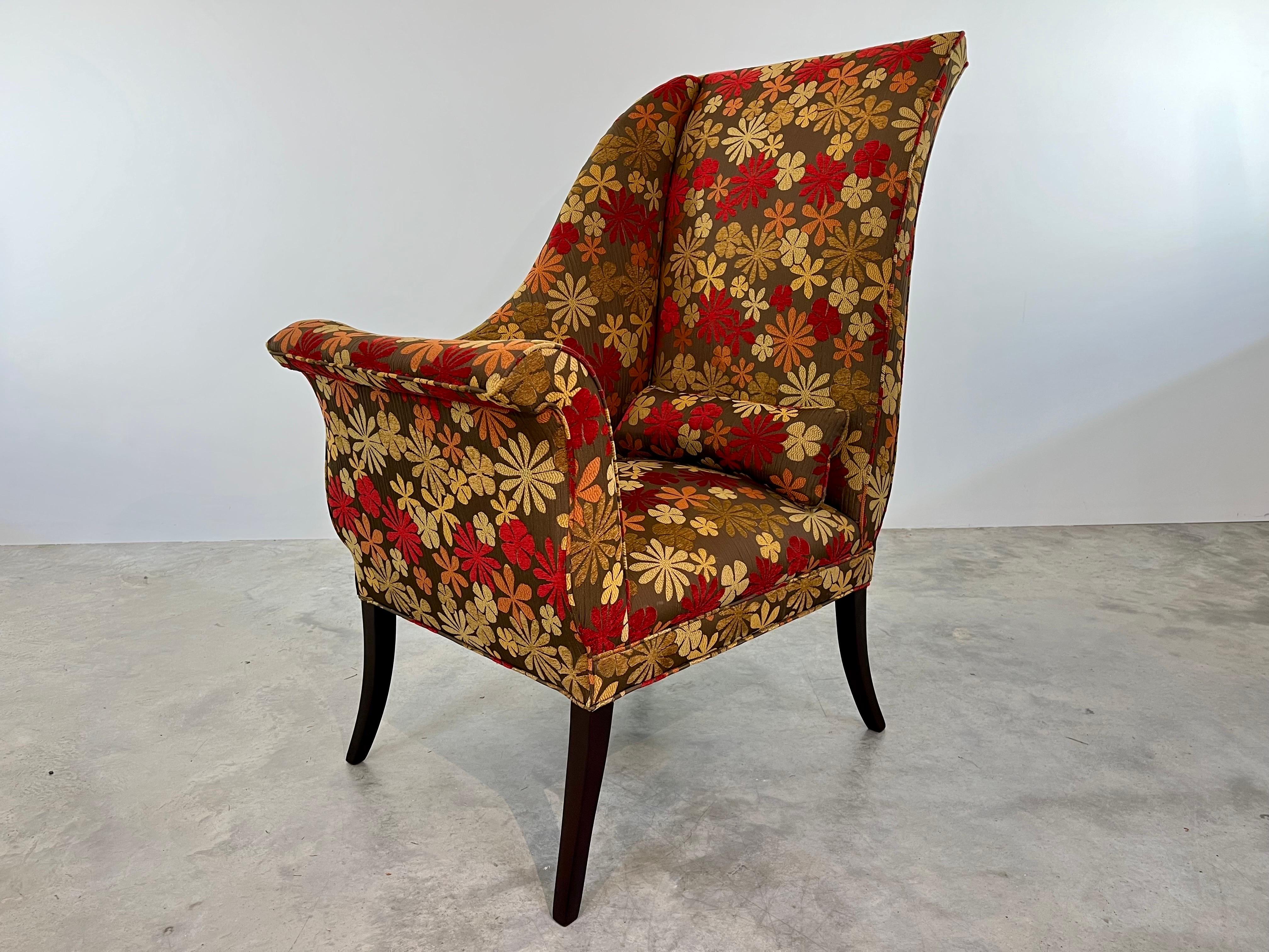 Mid-Century Wingback Parler Deux Chair-Right having walnut klismos legs with textured wool floral upholstery. An incredibly comfortable design having dramatic lines throughout with a playful upholstery design. Circa 1950. 
 This original design