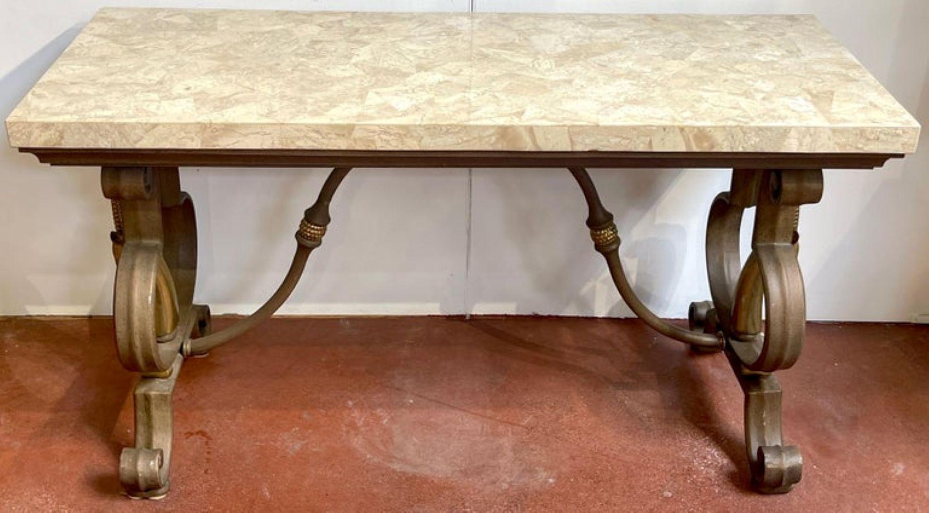 Hollywood Regency Wrought Iron and Tessellated Stone Console
Attributed to Maitland-Smith, circa 1980s

A Hollywood Regency wrought iron and tessellated stone console table, attributed to Maitland-Smith, circa 1980s. This substantial piece stands