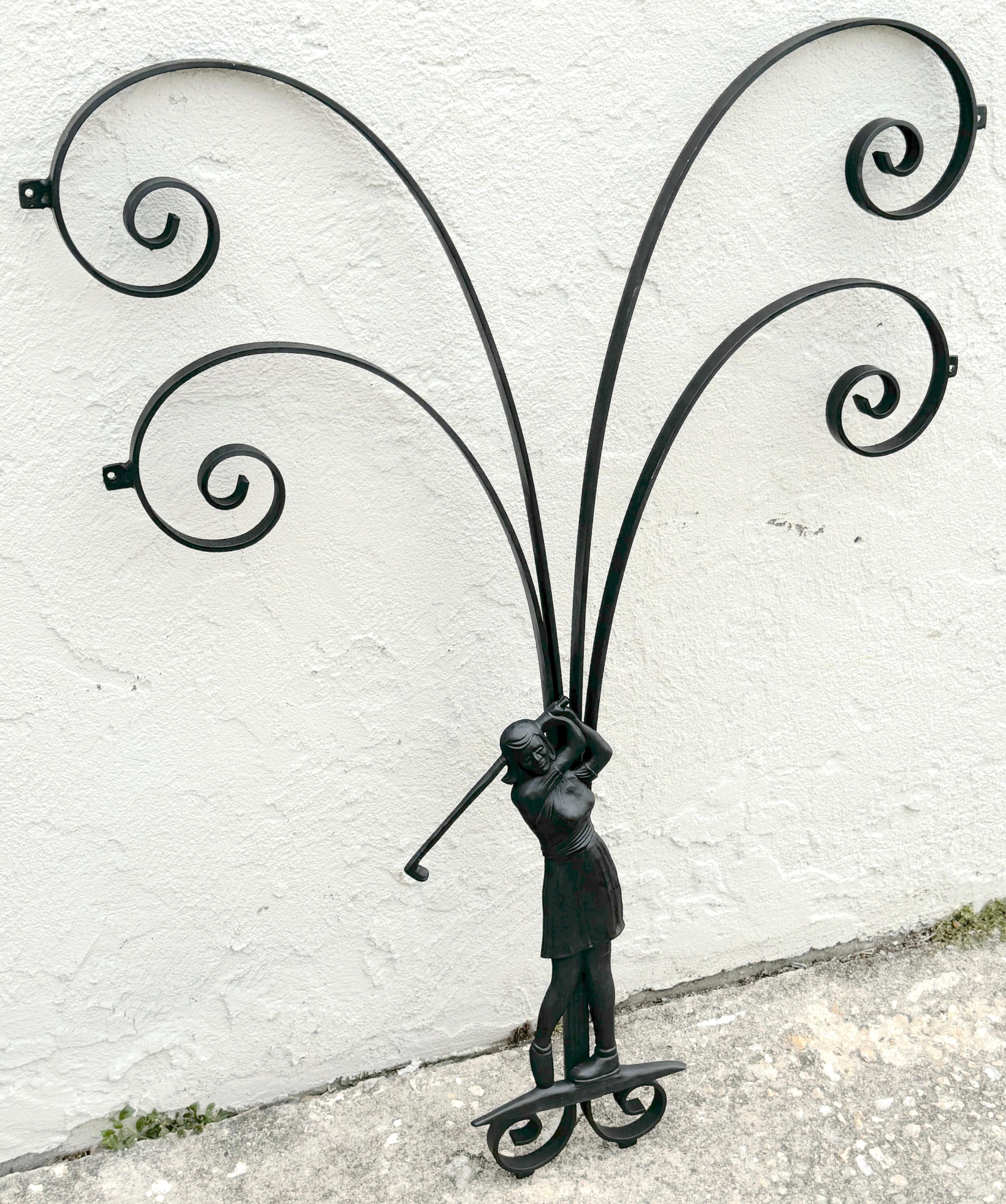 Hollywood Regency Wrought Iron Lady Golfer Exterior/Interior Wall Sculpture 
USA, circa 1960s

This striking Hollywood Regency Wrought Iron Lady Golfer Wall Sculpture, made in the USA during the 1960s, is a distinctive work that captures the essence