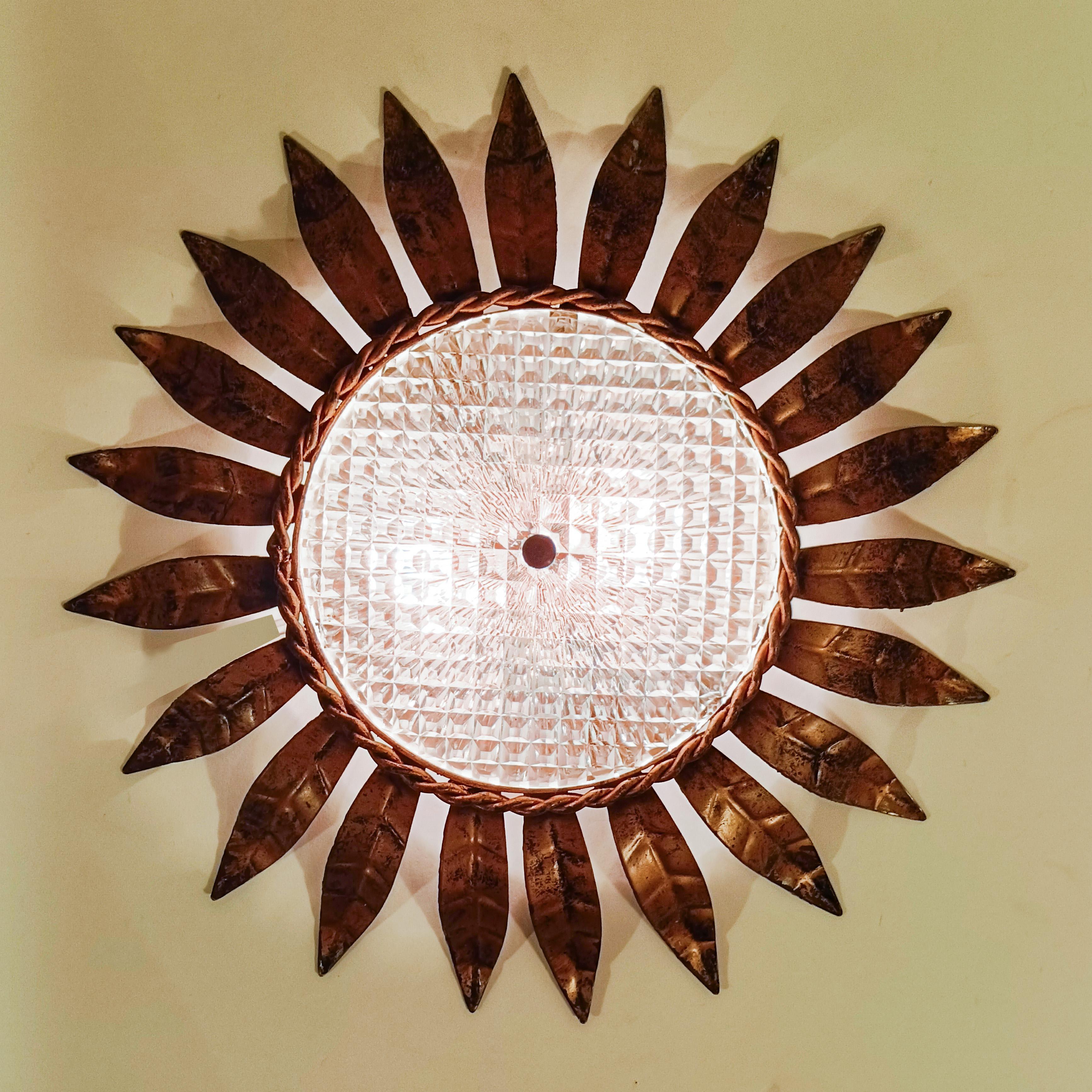 Hollywood Regency. Wrought iron Sunburst flush mount by Ferro Art, Spain, 1950s In Good Condition For Sale In SANT ADRIÀ DE BESÒS, ES