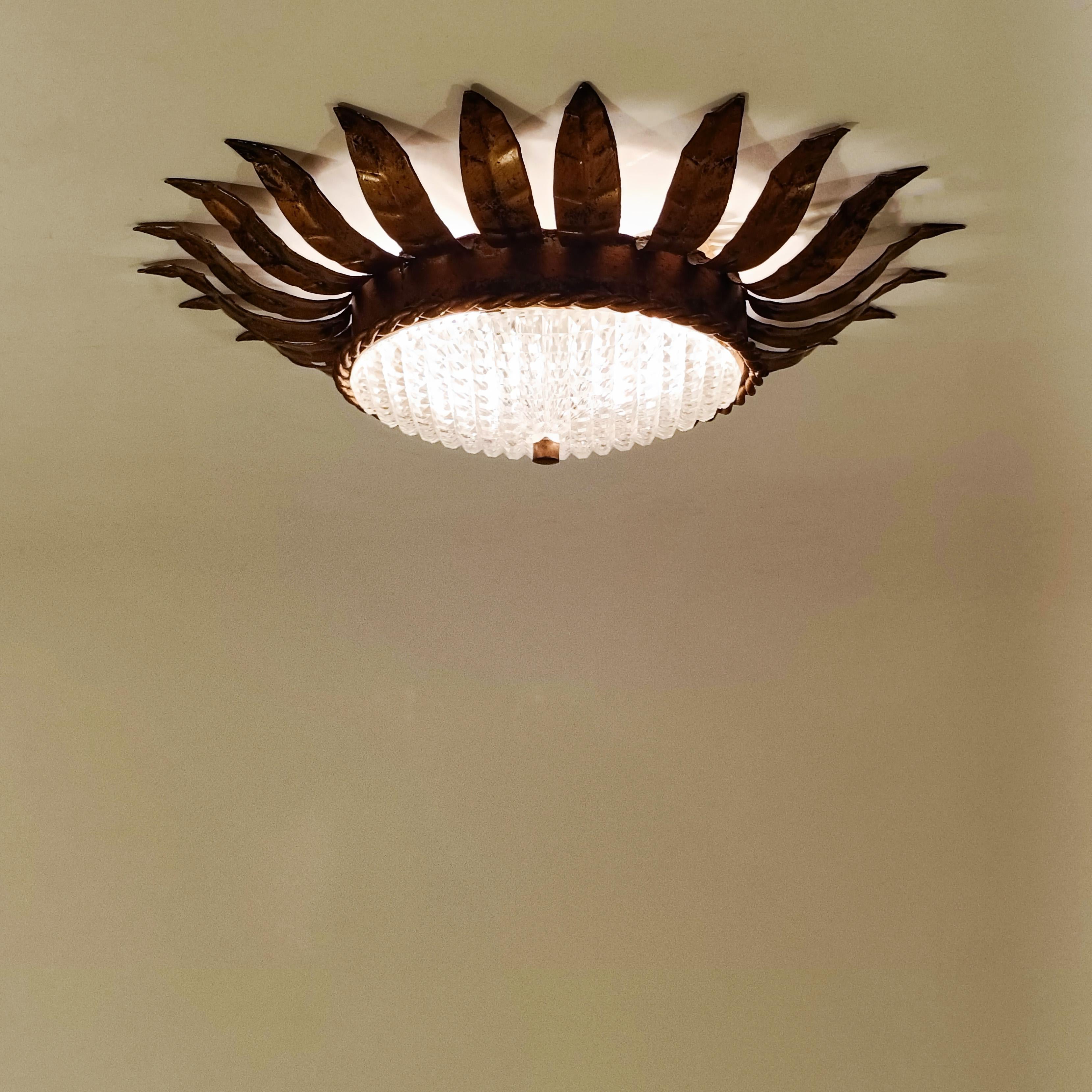 Brass Hollywood Regency. Wrought iron Sunburst flush mount by Ferro Art, Spain, 1950s For Sale