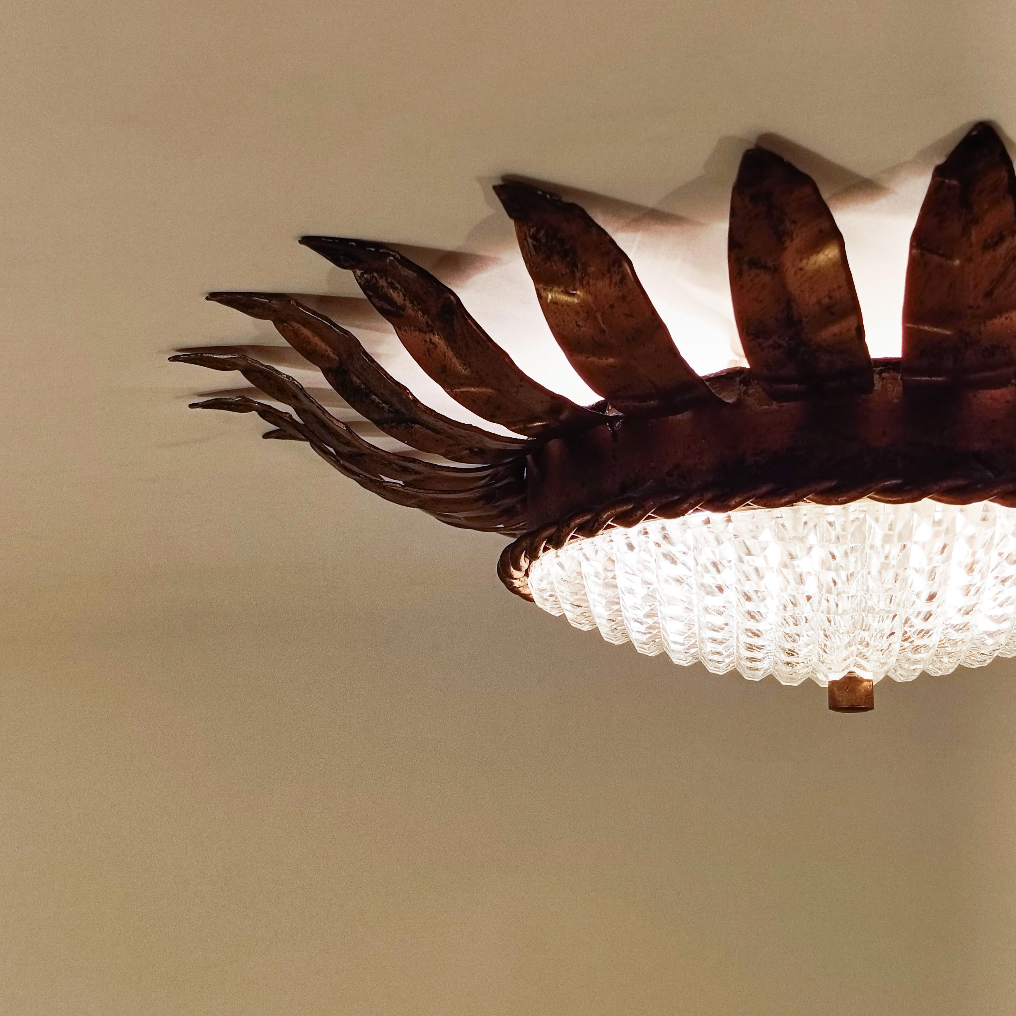 Hollywood Regency. Wrought iron Sunburst flush mount by Ferro Art, Spain, 1950s For Sale 1
