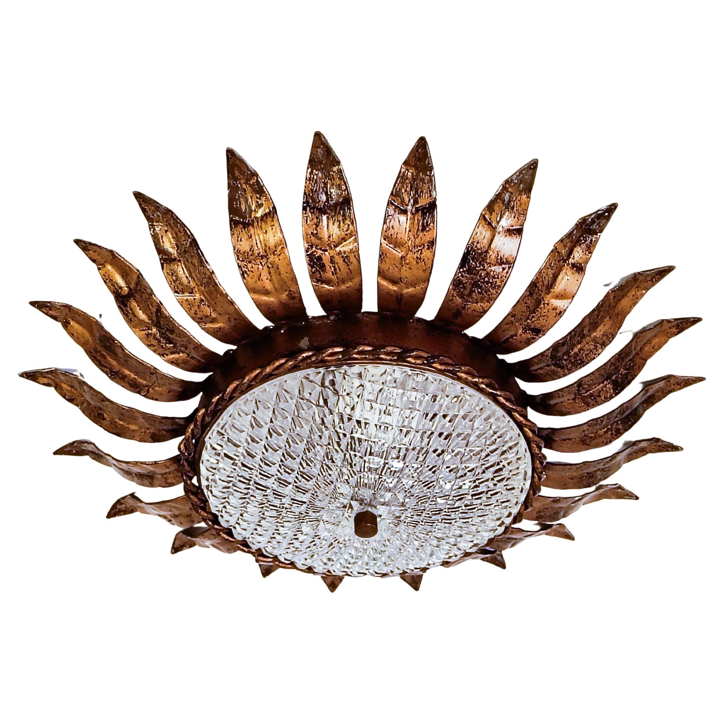 Hollywood Regency. Wrought iron Sunburst flush mount by Ferro Art, Spain, 1950s For Sale