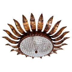 Hollywood Regency. Wrought iron Sunburst flush mount by Ferro Art, Spain, 1950s