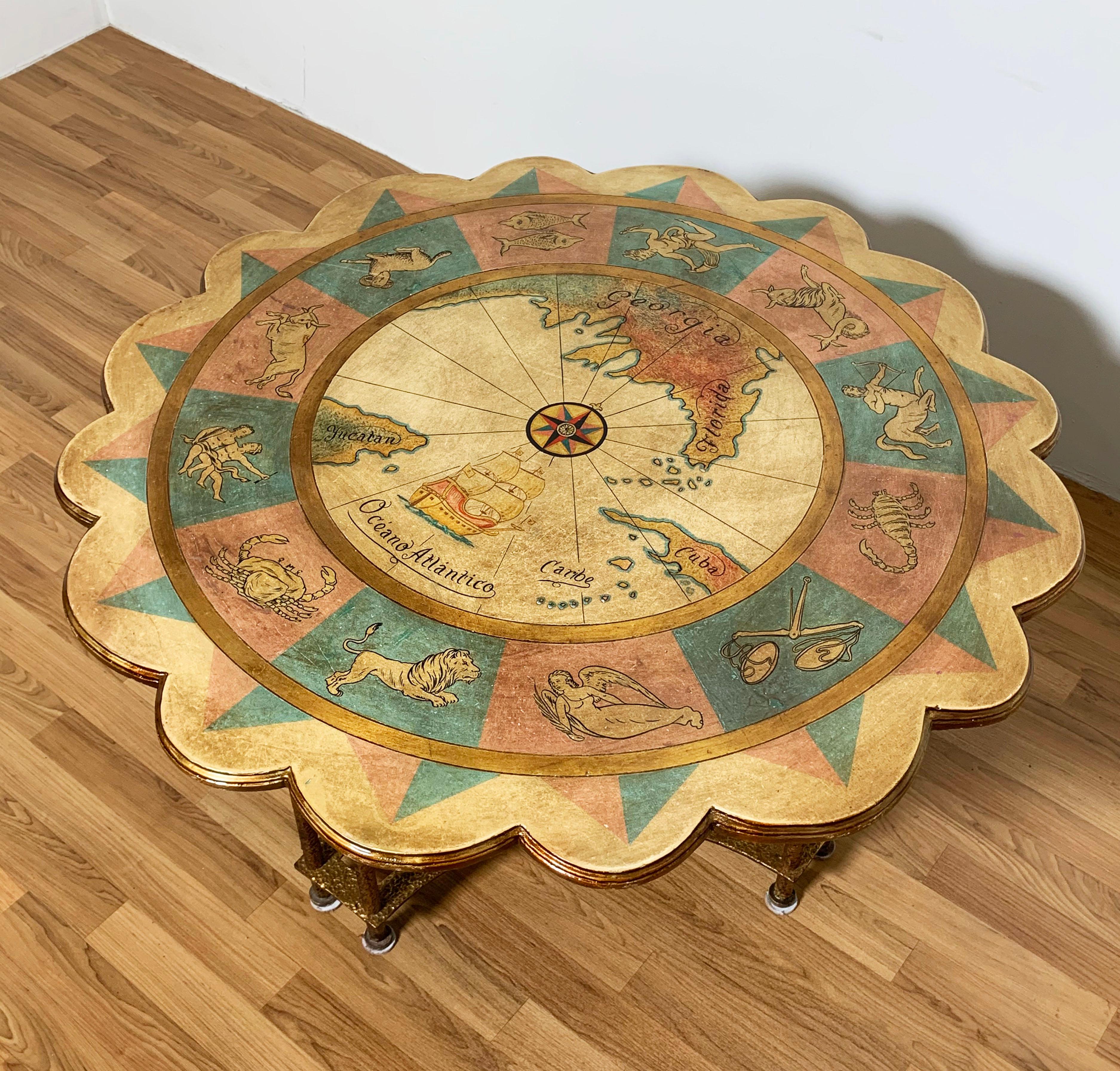 An original Italian made scalloped edge, zodiac-themed coffee table on gilt metal base, circa 1960s.