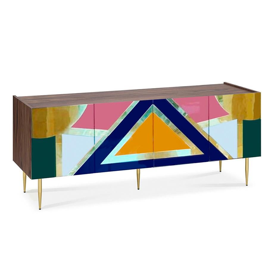 Yucatan sideboard is a piece of furniture that pays tribute to the vibrant and colorful culture of the Mayans.
This sideboard is crafted from warm walnut wood and features two double-door compartments, providing ample storage space for your dining