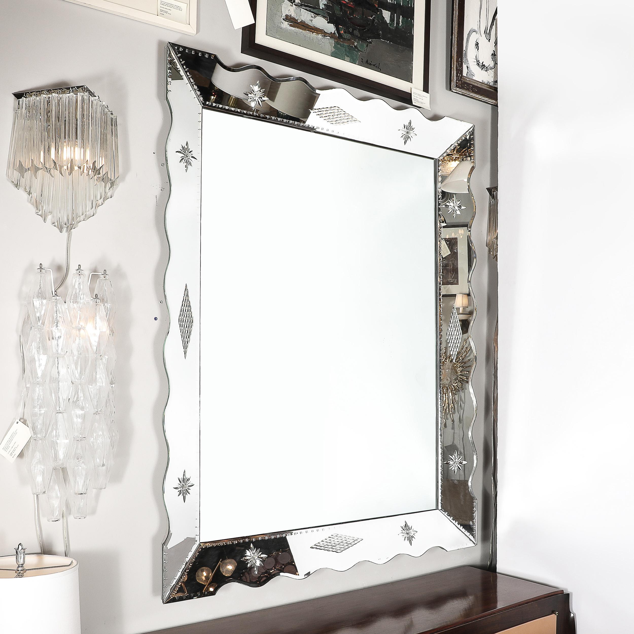 Elevate your space with the Hollywood Venetian Glass Scalloped Shadowbox Mirror, a bold and sophisticated piece from circa 1940. Its large, striking presence features a unique scalloped edge and a deep shadowbox design that adds depth and dimension