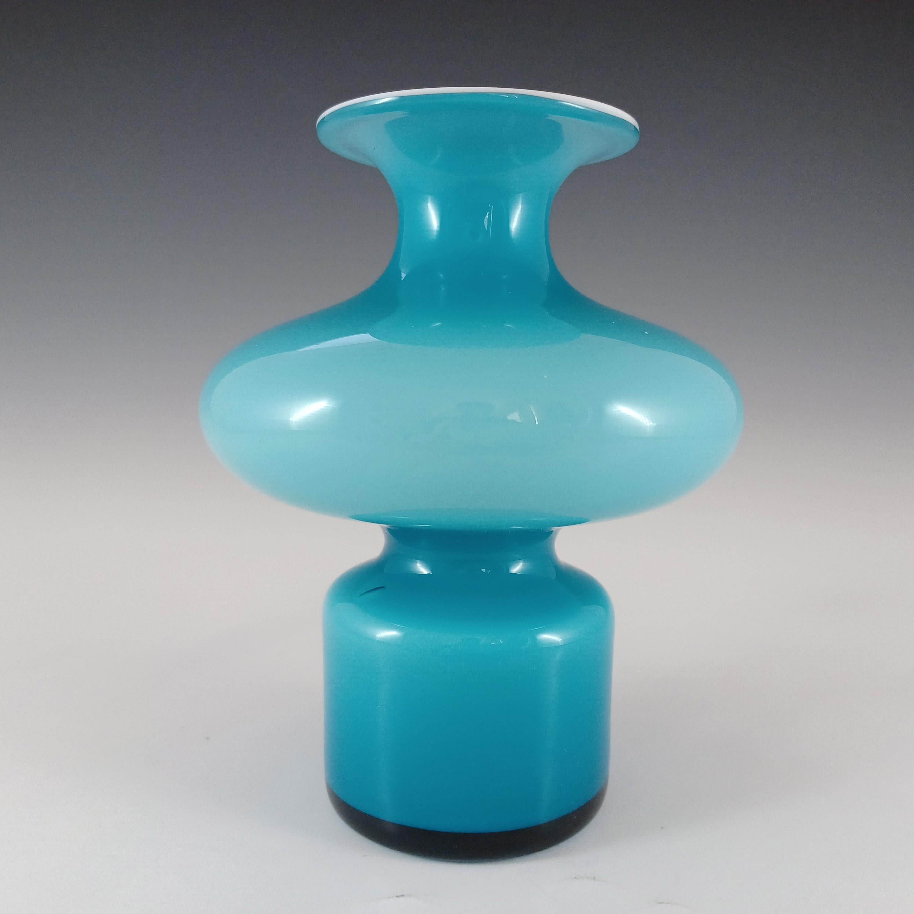 A stunning Scandinavian blue cased glass hooped vase with white interior casing. Made by Holmegaard of Denmark, designed by Per Lutken, part of his 