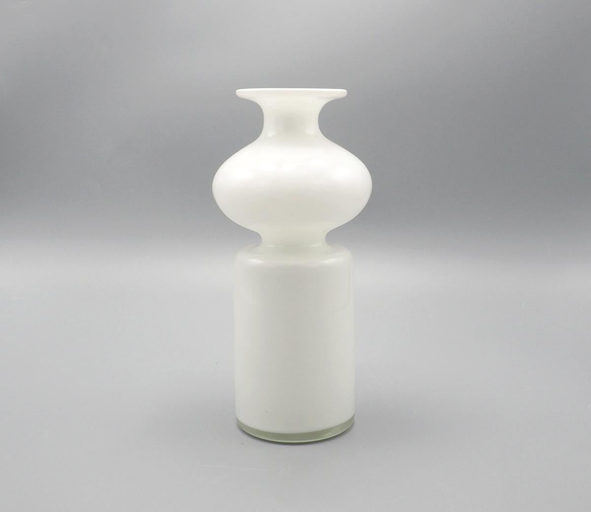 Vintage glass vase produced by Holmegaard Denmark

Model Carnaby designed by Per Lütken in the 1960s.

The vase is made of double-walled white milk glass

The cylinder shape with a ball in the middle gives the vase its quirky and playful