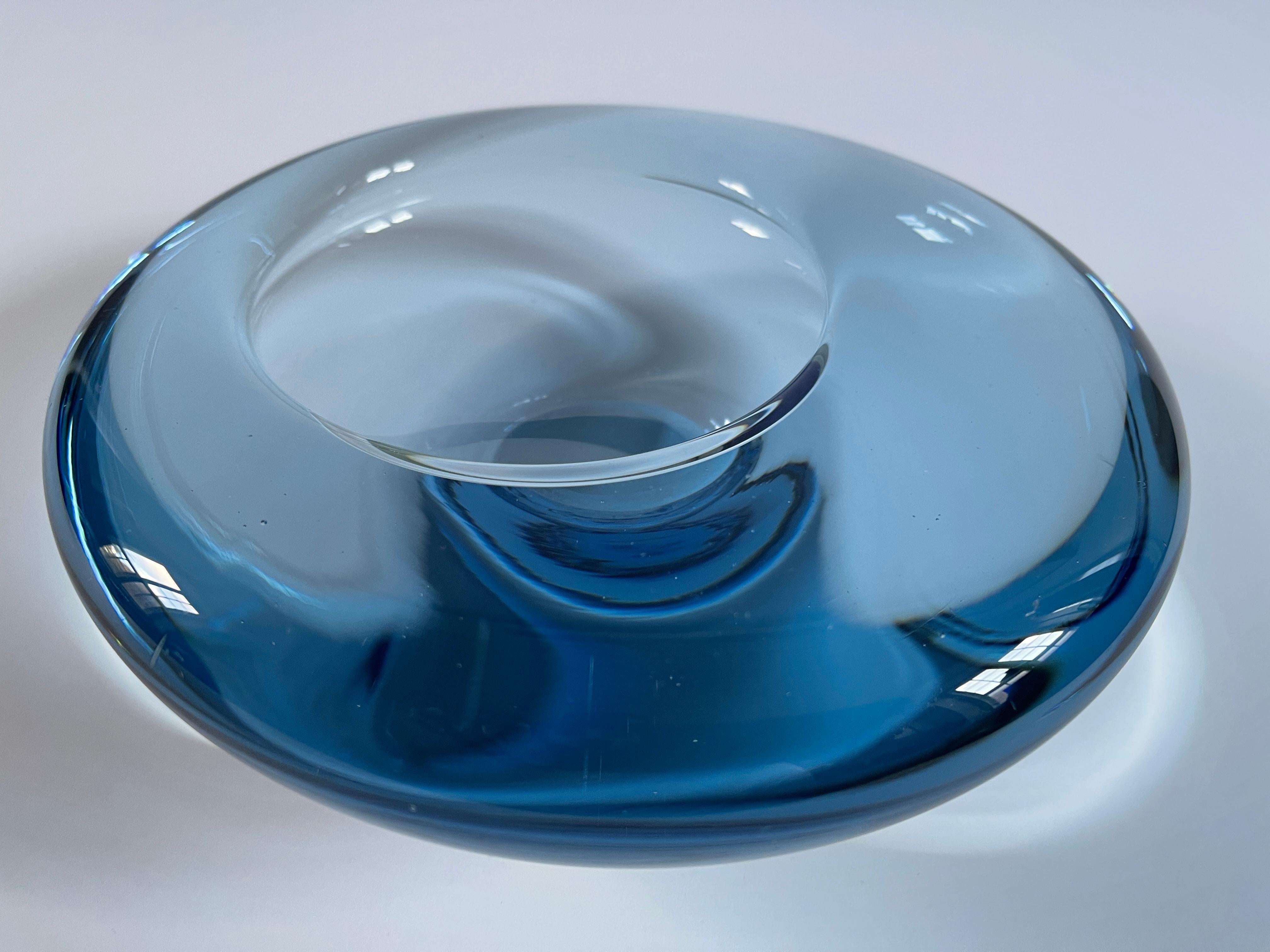 Stunning Danish mid century aquamarine glass sculptural bowl / vide poche designed and signed by Per Lutken for Holmegaard, Denmark, c. 1960's.
Signed by hand with engraved PL signature , HOLMEGAARD 16039.
