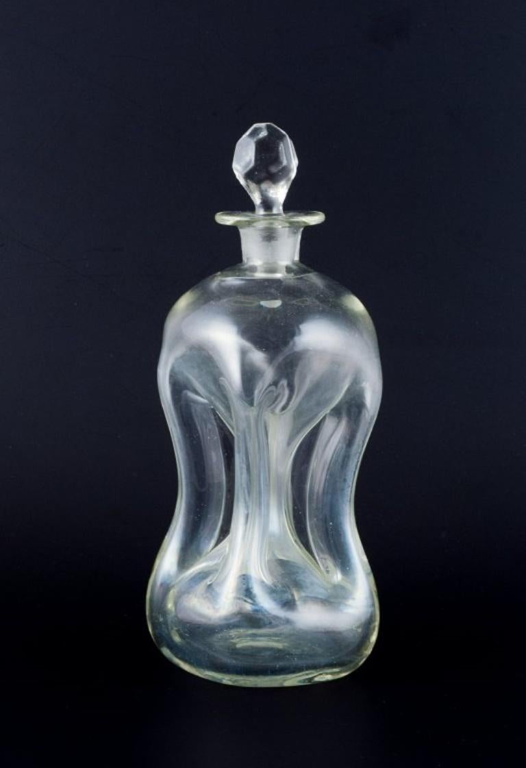 Holmegaard, Denmark.  'Cluck Cluck'  decanters in clear hand-blown glass.
From the 1930s/40s.
In excellent condition.
Tallest: H 22.5 cm x D 7.5 cm.
