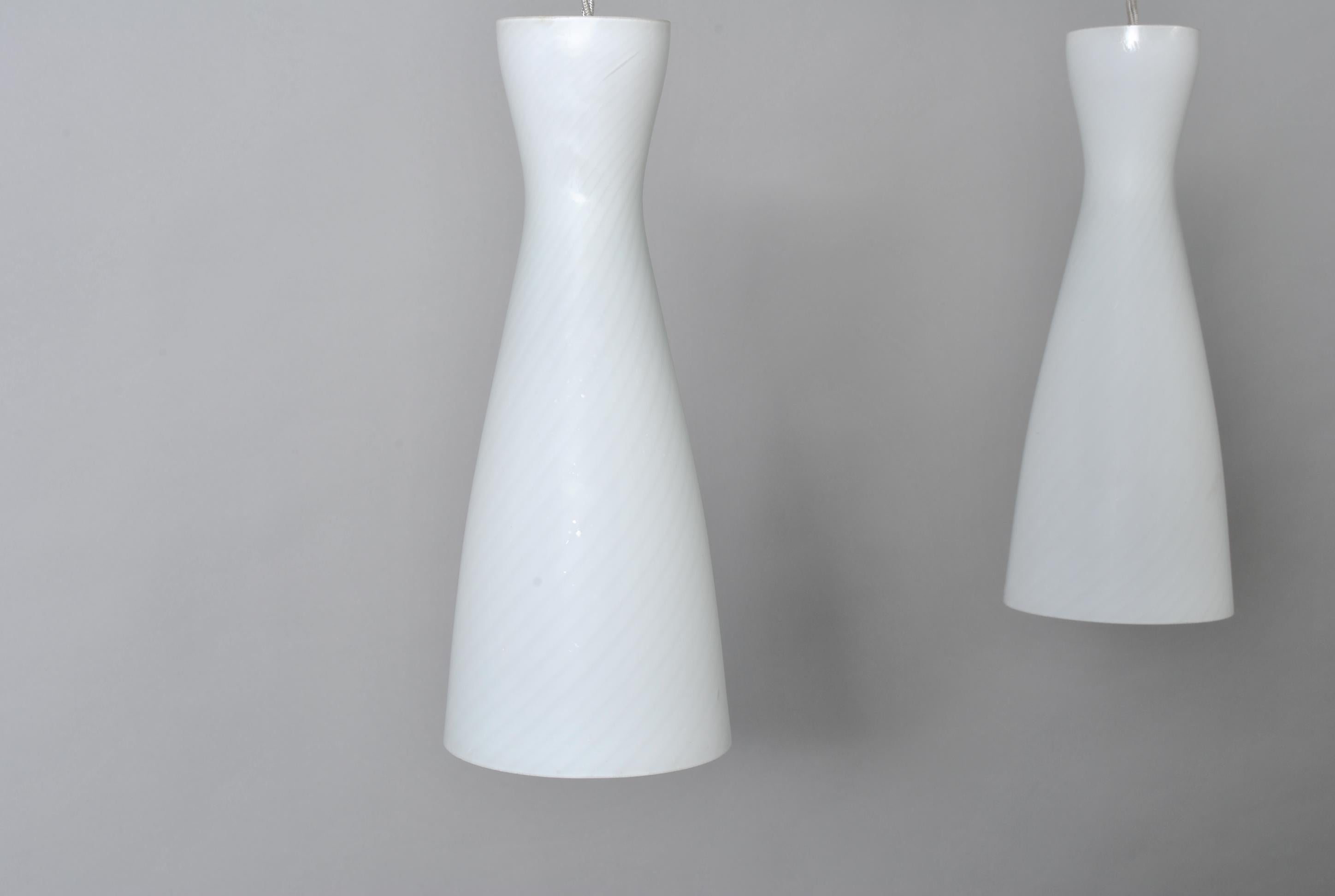 Midcentury Danish Holmegaard glass Dual drop pendant light. The two glass cones hang from a polished hardwood yoke. Fully rewired. Height/drop adjustable but currently approx 60cm. The cable can be changed to another color if required. Measures: