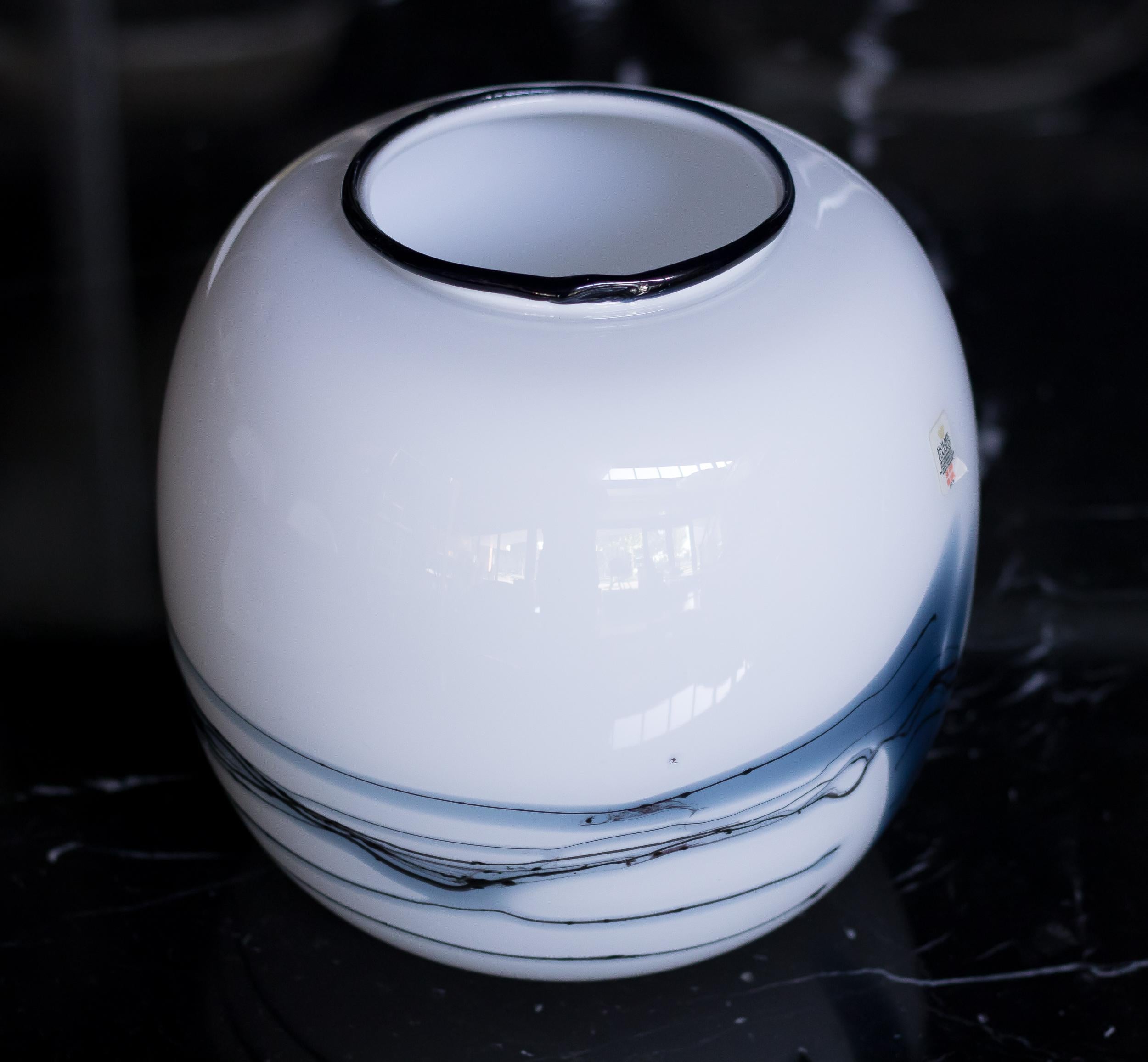 Round vase designed by Michael Bang for Holmegaard, Copenhagen. 
From the Atlantis series made in 1981. 
White, black and blue glass. Original Holmegaard sticker.
No chips or scratches.

Michael Bang is a renowned Danish glass artist known for his