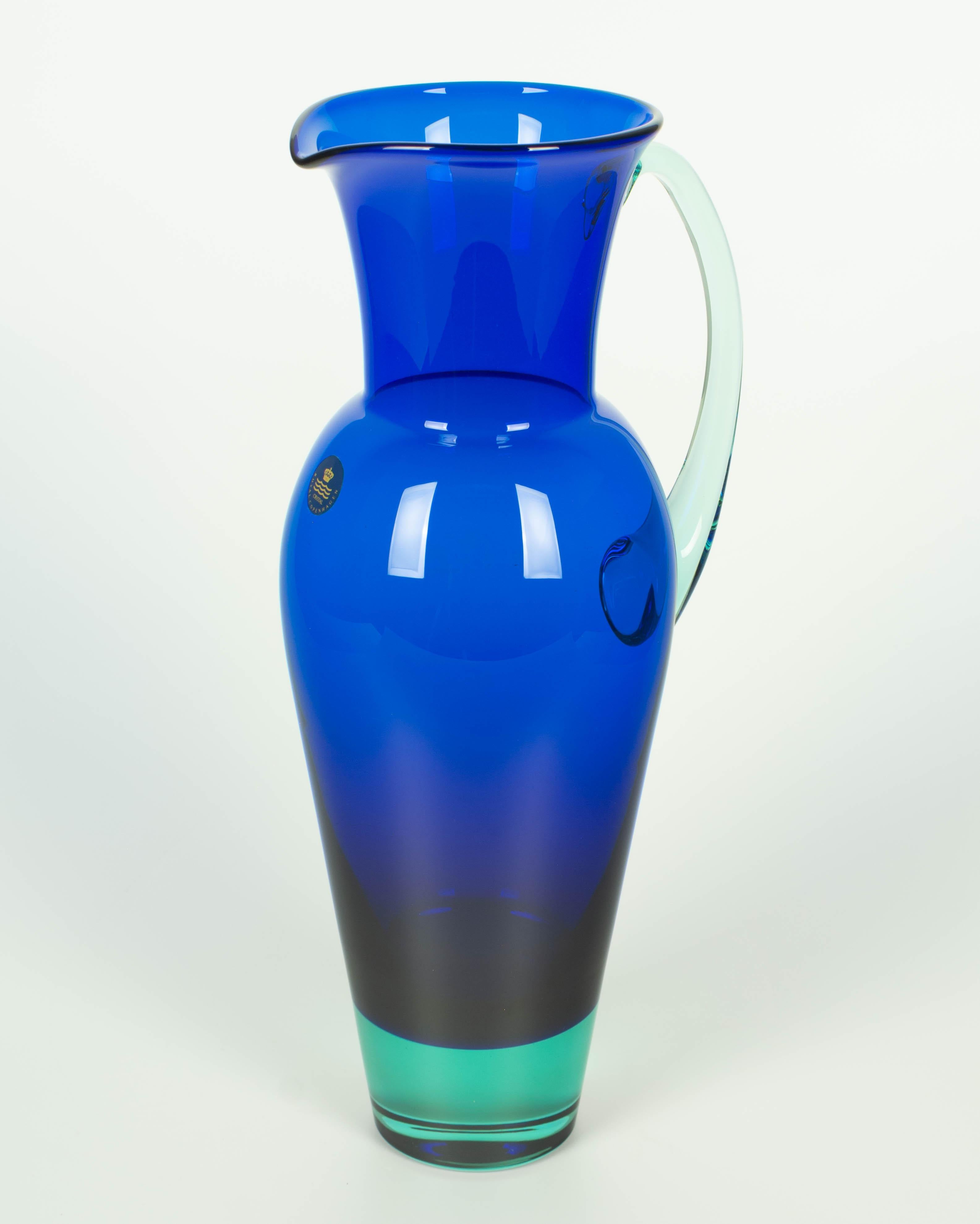Vintage cobalt blue and green crystal pitcher made by Holmegaard Glass for Royal Copenhagen. Original Royal Copenhagen sticker. Circa 1980s.
Dimensions: 5