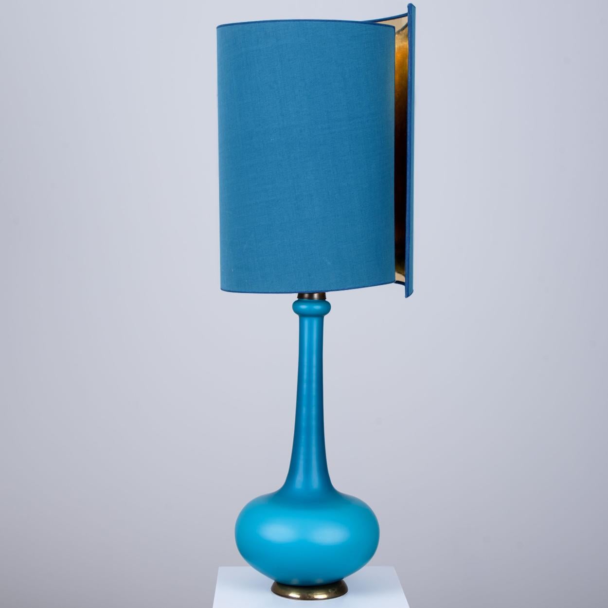 Glass table lamp by Holmegaard, Denmark, 1960s. Sculptural piece made of handmade glass in ocean blue tones. With new matching custom made blue silk lamp shade with warm gold inner, shade by René Houben.

The pair is in perfect vintage condition