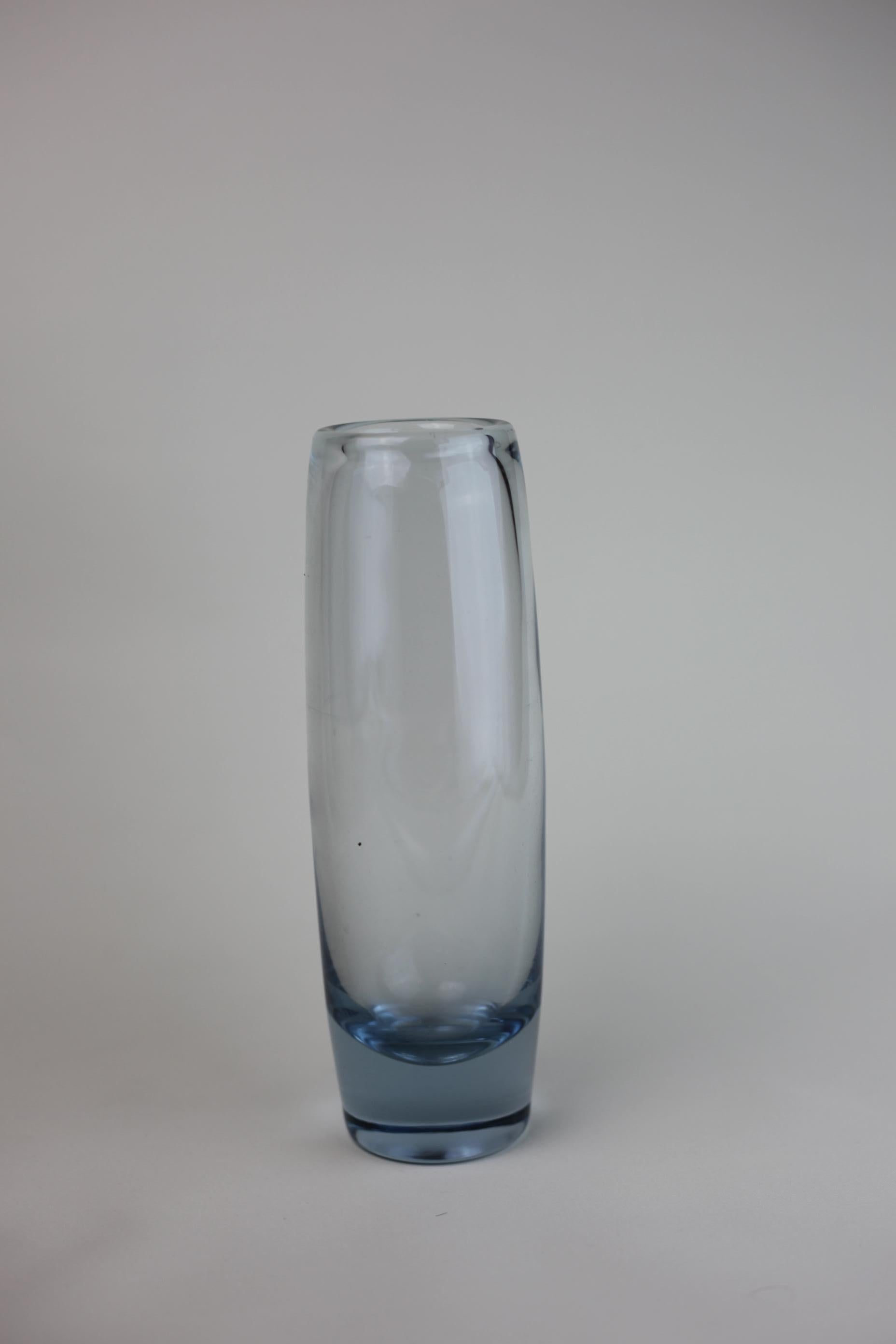 This simple but stunning vase is a classic 1960 Per Lütken vase. Handmade and signed to the bottom. 

Give of a nice light.