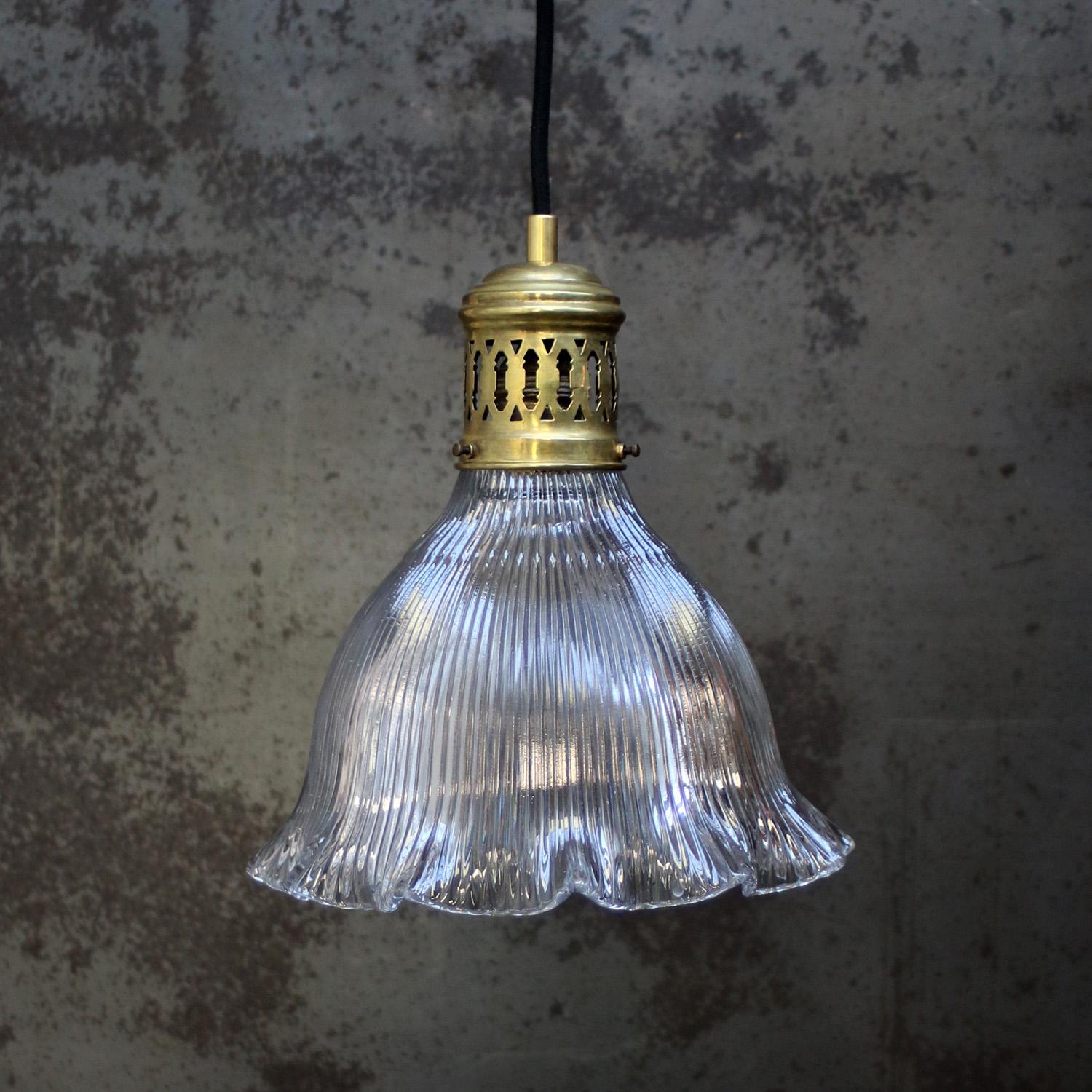 Vintage Brass and glass pendant by Holophane, France
Brass top with cut glass shade

Weight: 1.70 kg / 3.7 lb

Priced per individual item. All lamps have been made suitable by international standards for incandescent light bulbs, energy-efficient