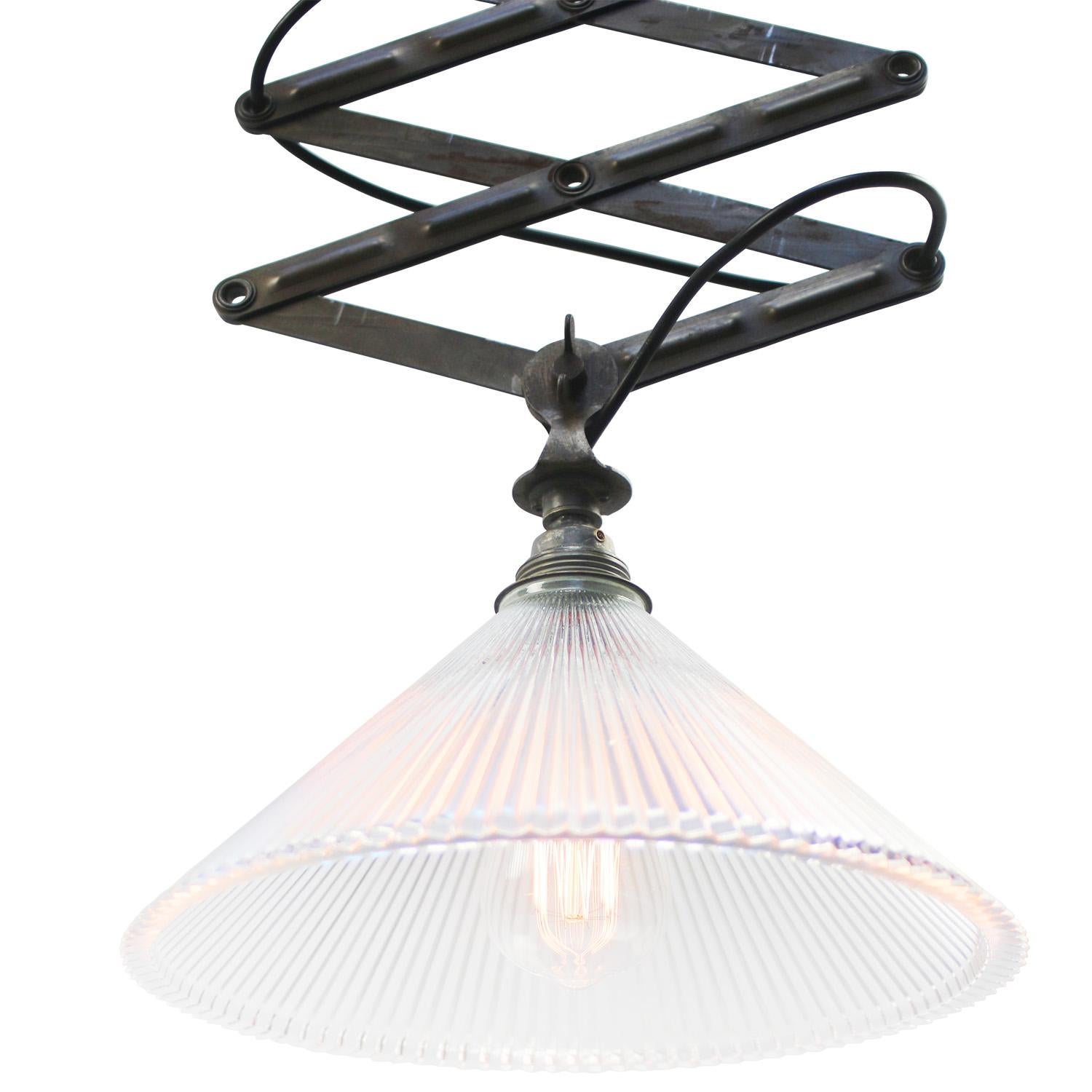 Iron scissor pendant, flush mount.
Adjustable in length and angle
Holophane clear glass shade

Shade size: diameter 30 cm
90° angle adjustable shade

as shown on picture 75 cm
min. length 40 cm
max. length 170 cm

metal mounting plate: 12 × 7