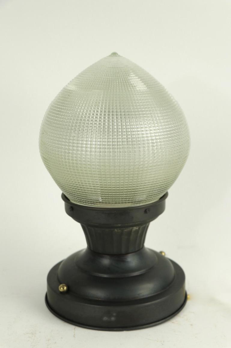 Hard to find Holophane ball shade, originally for a dental operating light, sometimes referred to as the onion shade. We have 1 globe available, each come with metal mount, working and ready to install. As is often the case with these shades, the