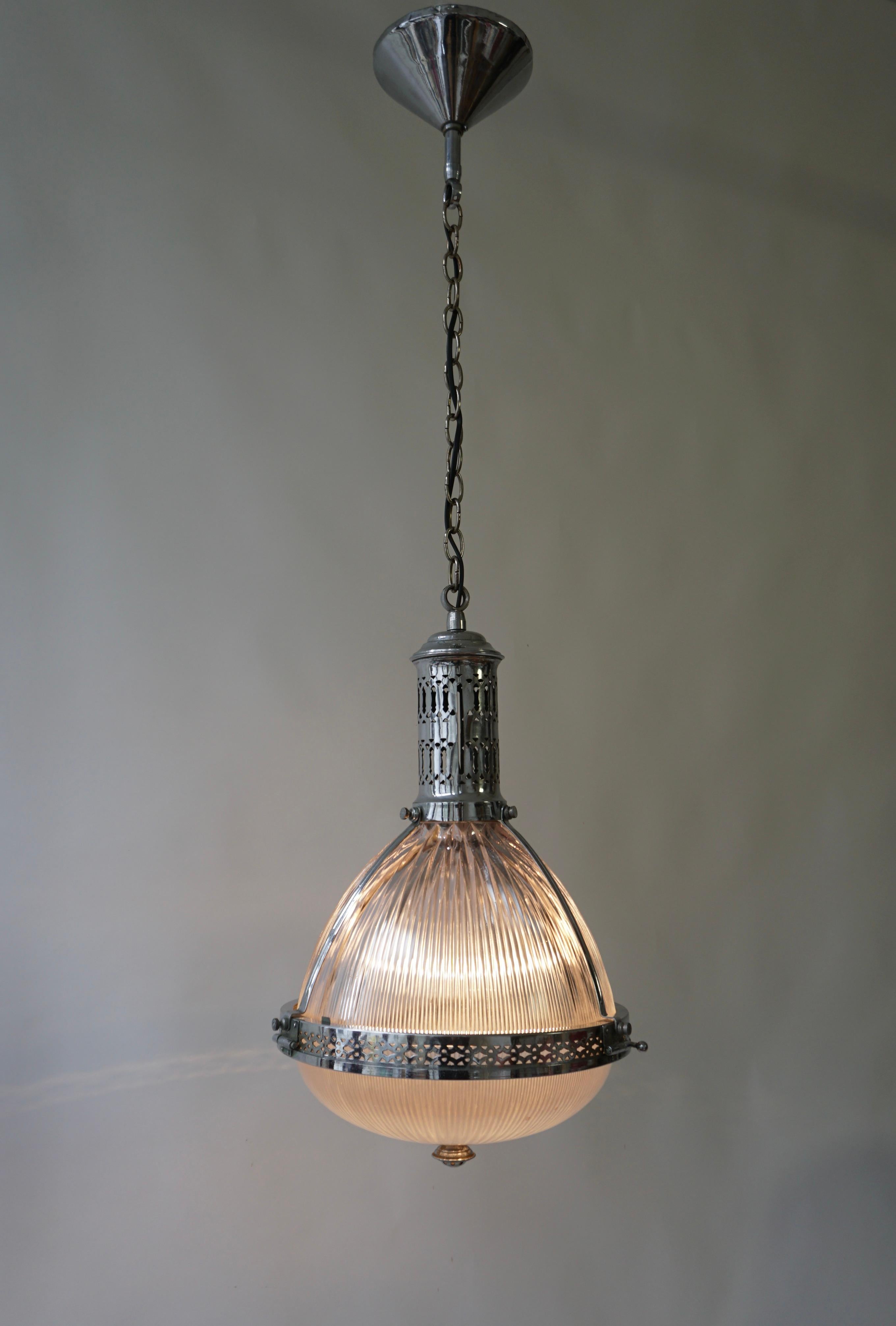 Beautifully formed pendant light made in England by Holophane. c.1920.

The lamp has one socket for incandescent lamps with screw base or E27 type LEDs. It is possible to install this fixture in all countries (US, UK, Europe, Asia, Canada), although