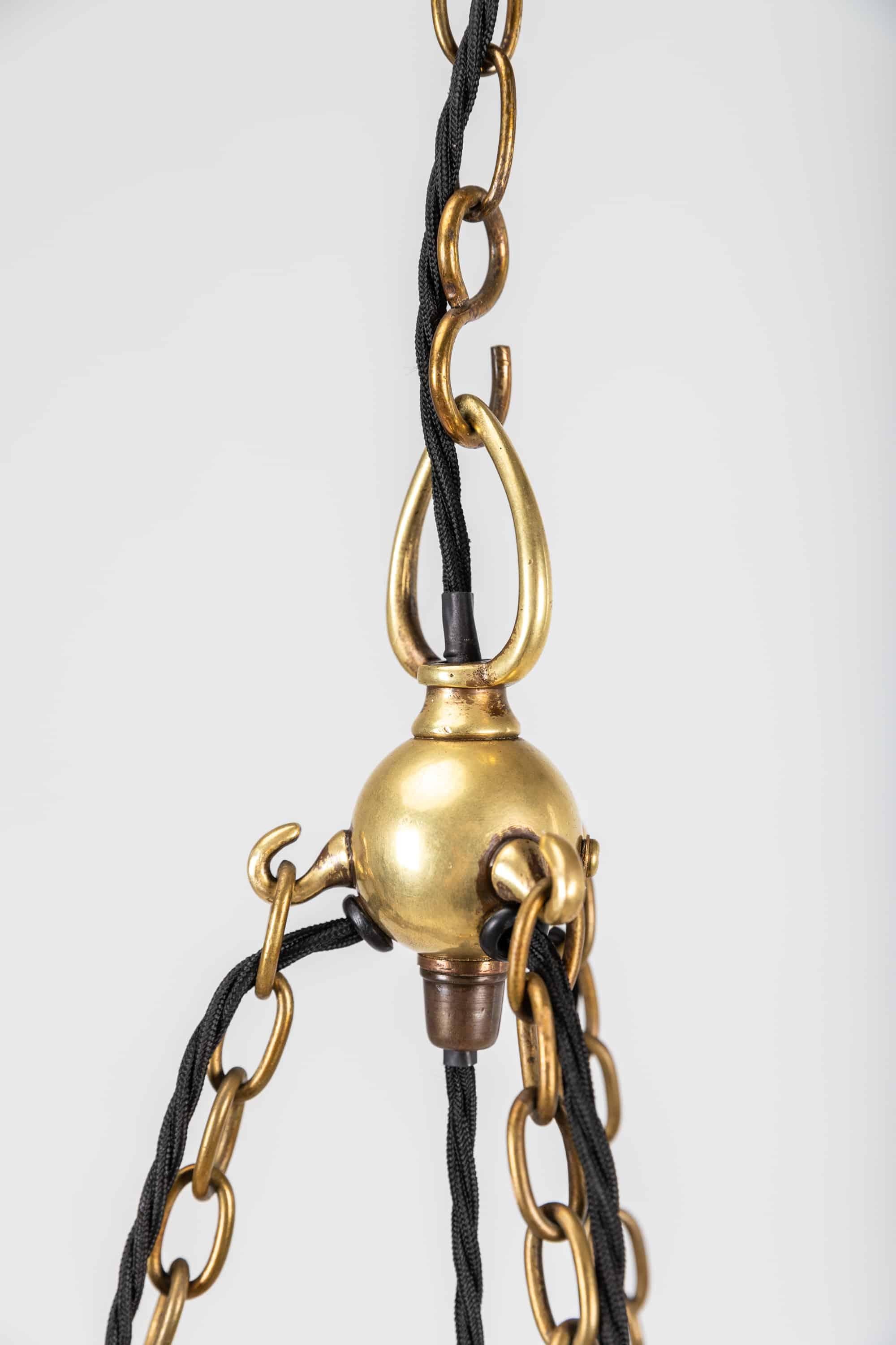 An incredible 'Stiletto' chandelier made in England by Holophane. c.1915.

Comprising of inner bowl, top plate, three 'stiletto' shades with original three armed ornate brass ring, galleries and ball hook.

A superb statement piece of period