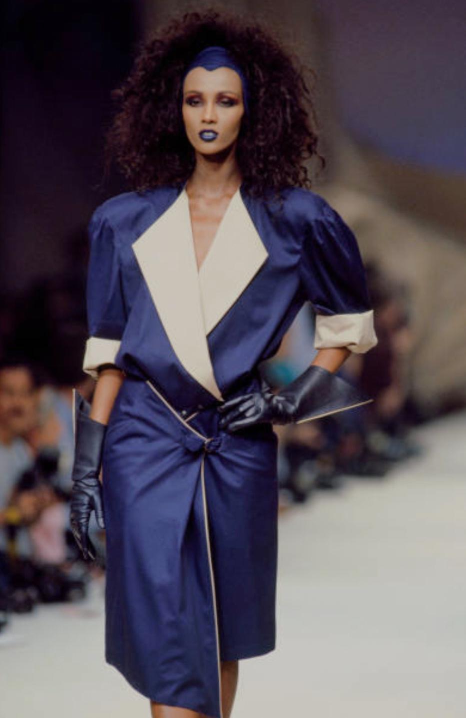 
Holy Grail Collectors Piece. Breathtaking Thierry Mugler Dress, Spring Summer Collection 1986. Worn by the gorgeous Iman on the Runway and also for the Campaign shoot. Documented Thierry Mugler Dress.
Dark blue dress with huge dramatic collar and