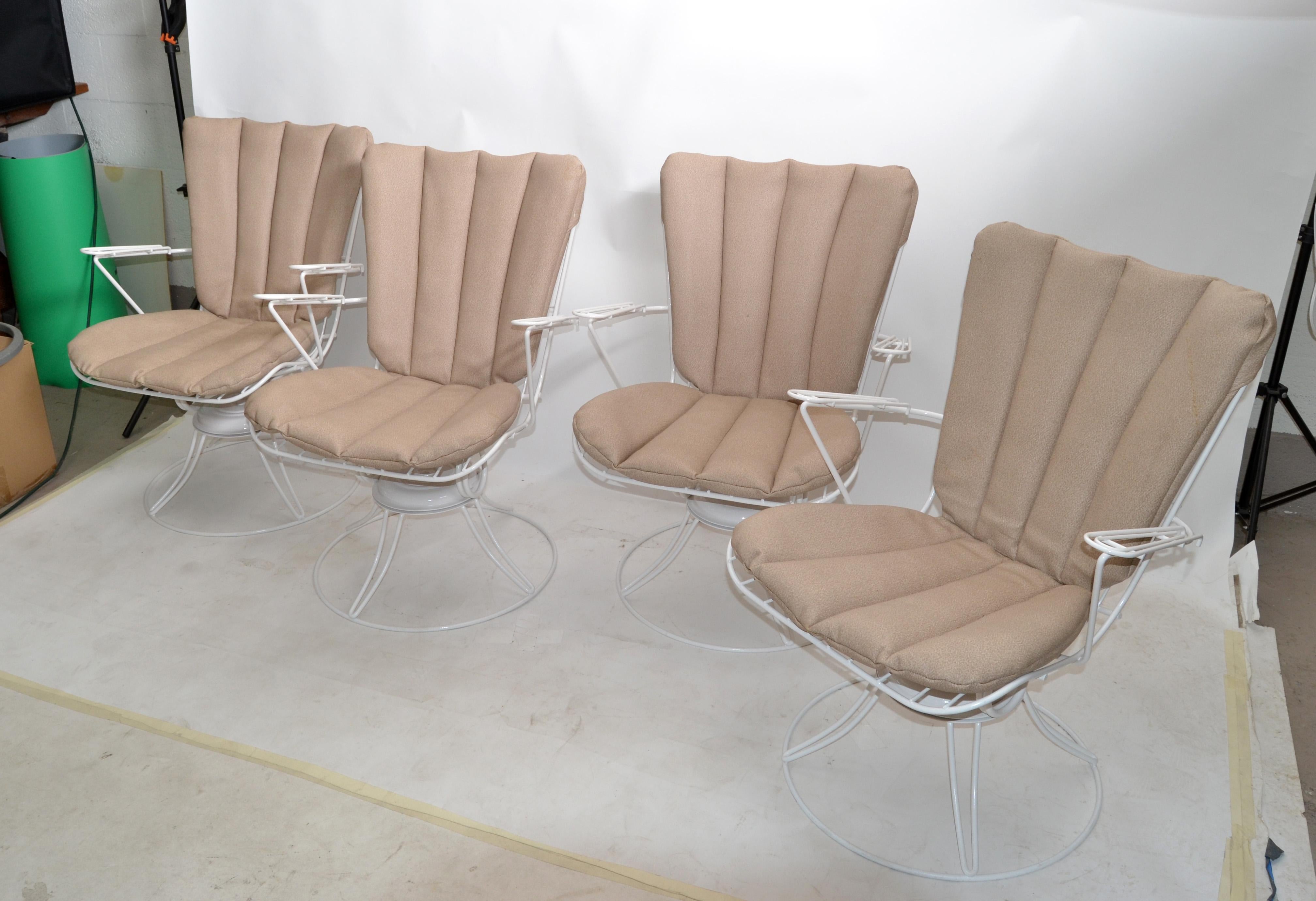 Set of four restored white swivel wire chairs with the original seat cushions.
Mid-Century Modern Eames Era from the 1960s made by Homecrest.
Very comfortable and swivel function works smoothly.
Arm Height: 24.5 inches.