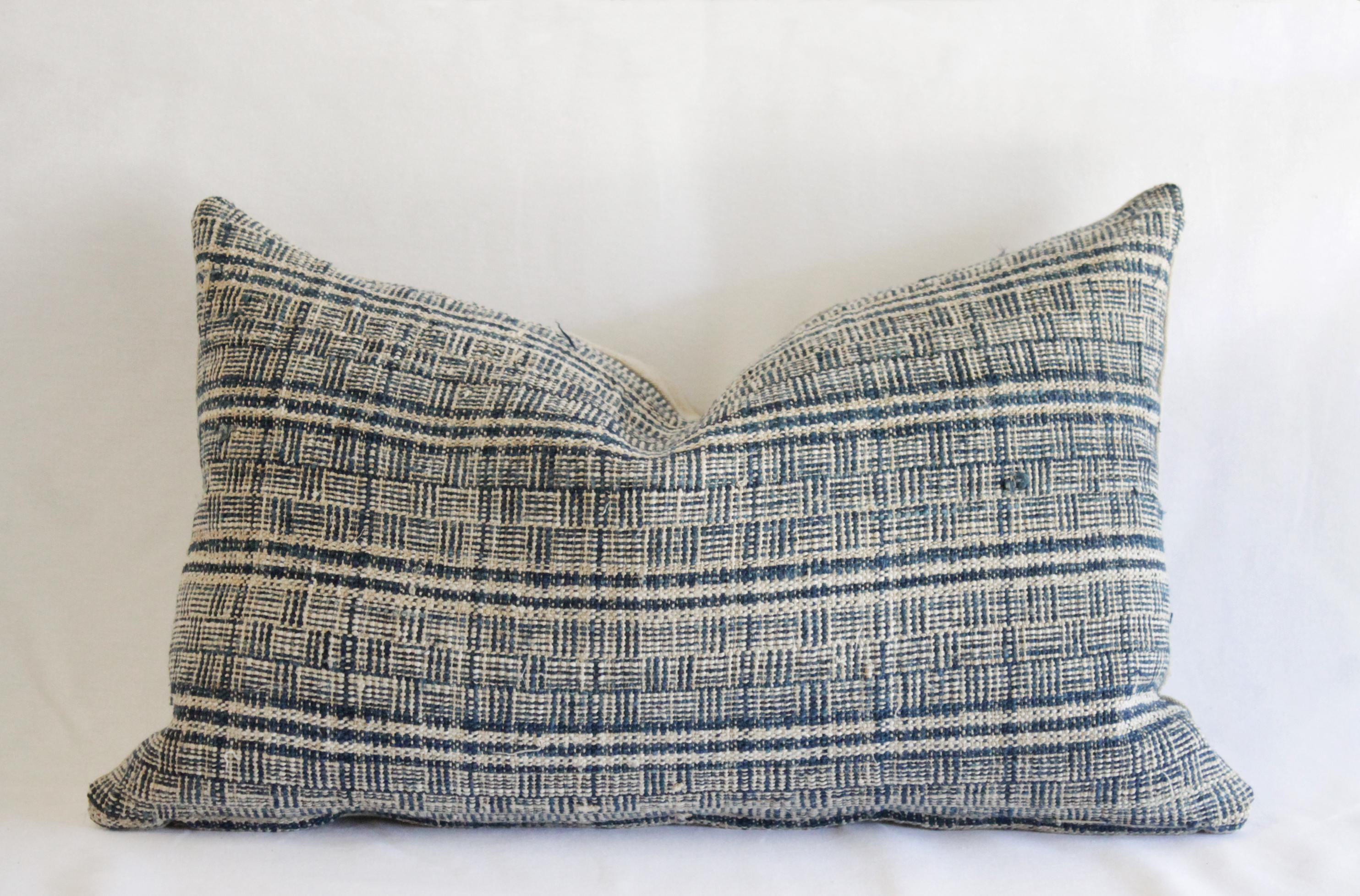 Antique Homespun Linen Lumbar pillows made from a vintage indigo and natural stripe grain sack linen, with a solid natural flax linen backing. Hidden zipper closure. Measures: 21