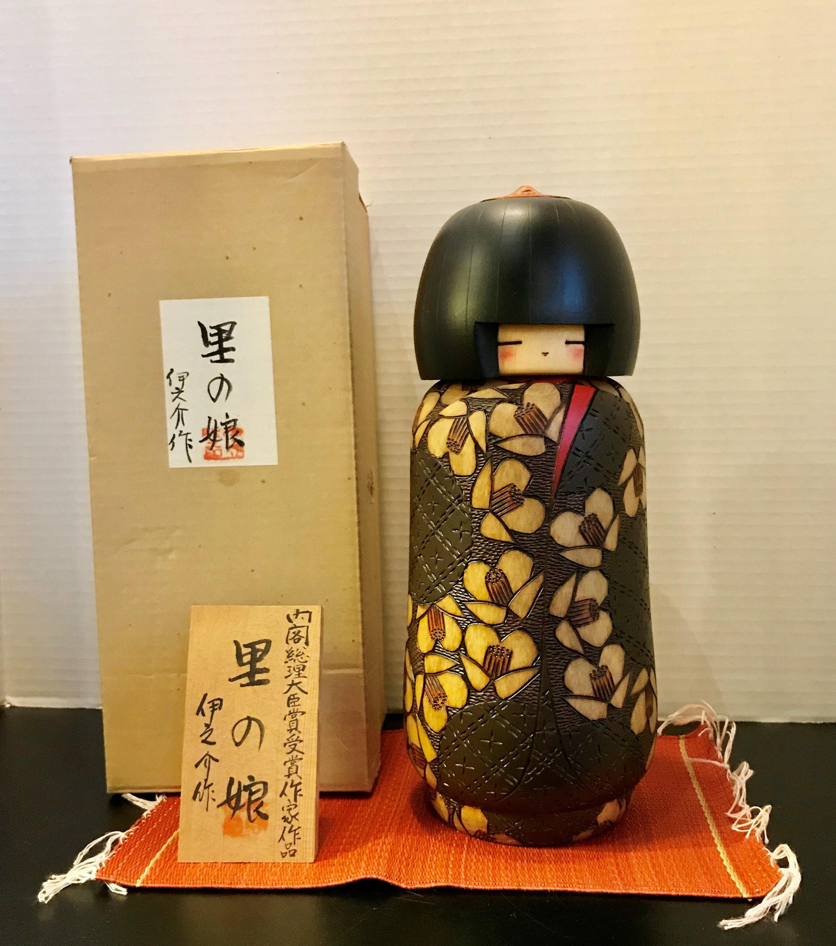 Kokeshi dolls in olden days were toys for children in Northen Japan which parents would gift to a new born child. Woods from the north of Japan would be used for the Kokeshi and a lathe and a plane would be used to create the body and head. The most