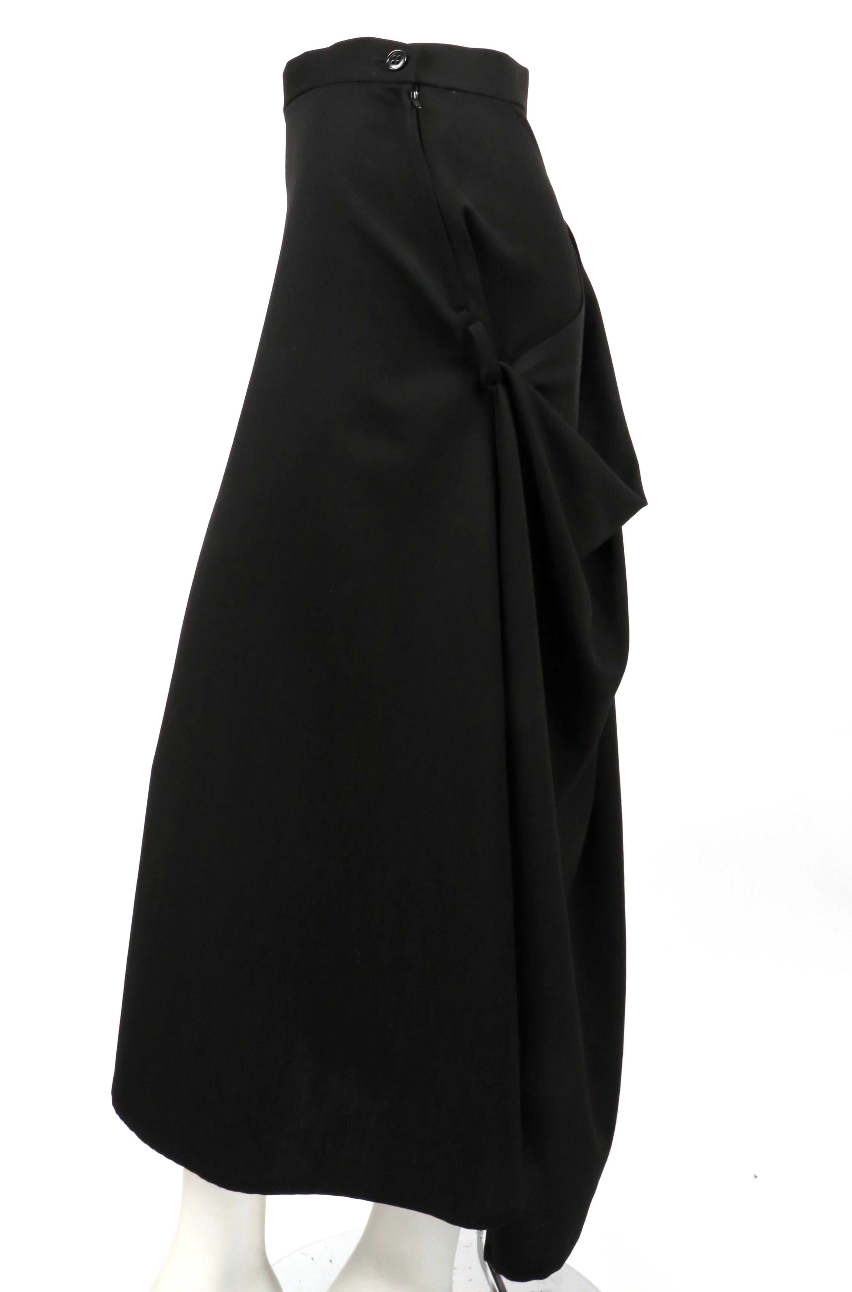 Jet-black draped wool skirt designed by Homma. Japanese size 3. Approximate measurements: waist 28