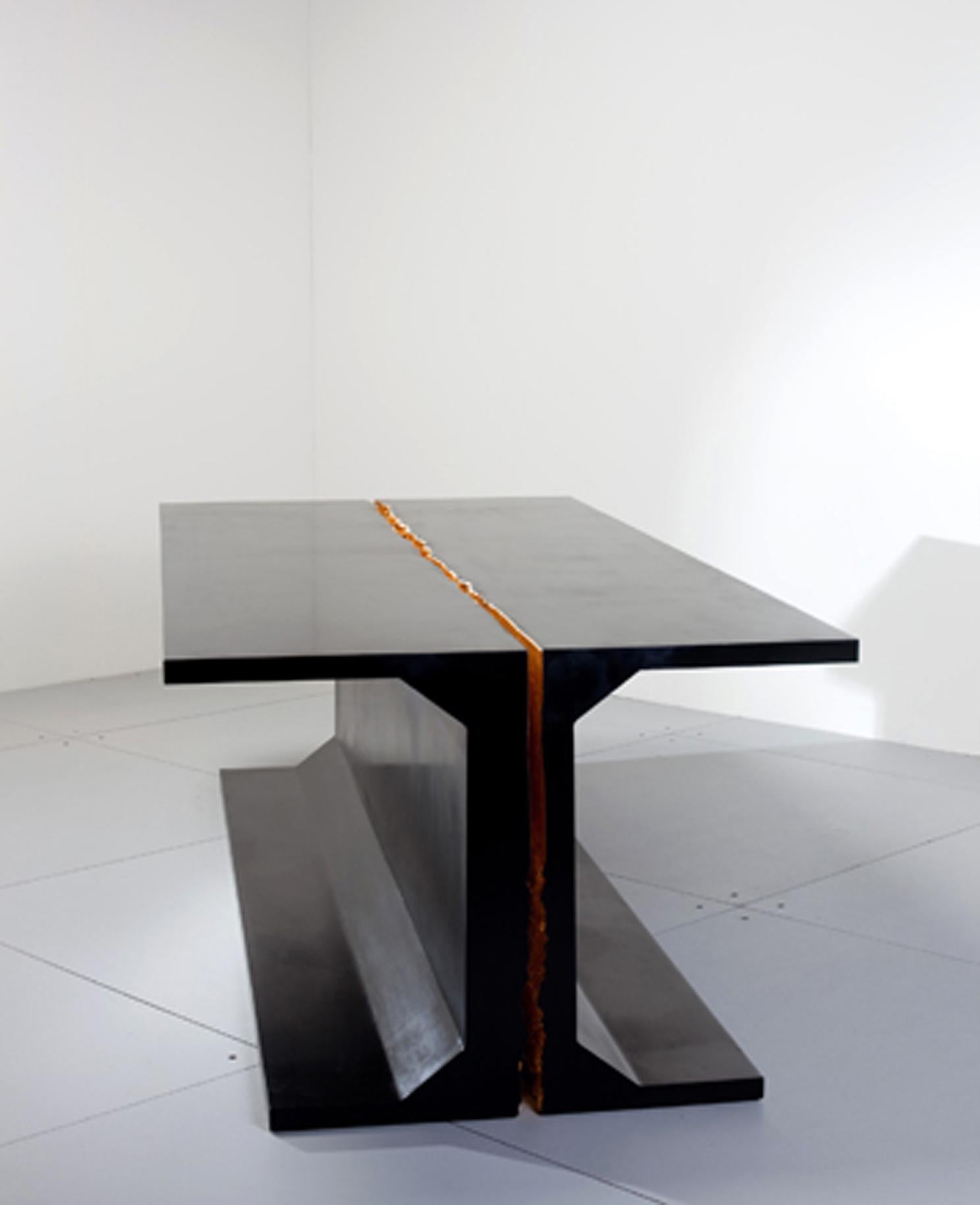 Unveiled in 2010 in collaboration with Carpenters Workshop Gallery, Thierry Dreyfus's Hommage Table is an elegant and intriguing table made of two mirroring parts. 