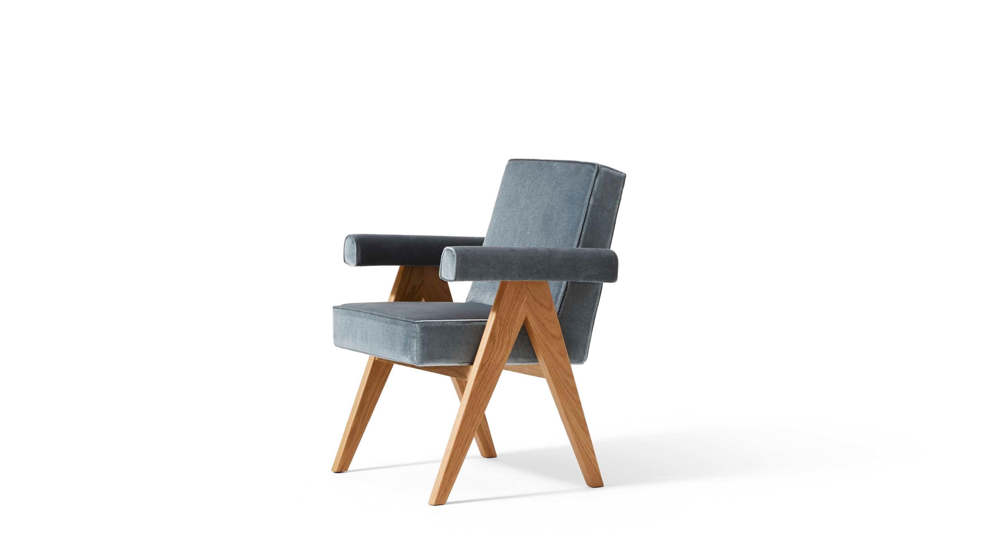 Hommege À Pierre Jeanneret Committee Chair With Arms For Cassina

Part of the Hommage à Pierre Jeanneret tribute collection, the dining chair with armrests is known for its elegantly bold lines and solid wood structure and the iconic upside-down “V”