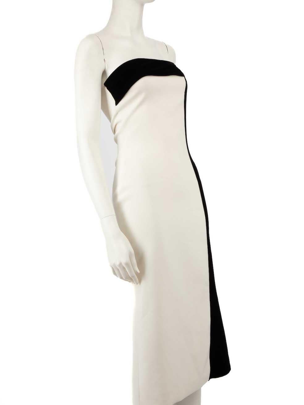 CONDITION is Very good. Minimal wear to dress is evident. Minimal marks to hem and bust on this used Honayda designer resale item.
 
 
 
 Details
 
 
 White
 
 Synthetic
 
 Dress
 
 Strapless
 
 Bodycon
 
 Black velvet trim
 
 Midi
 
 Side zip and