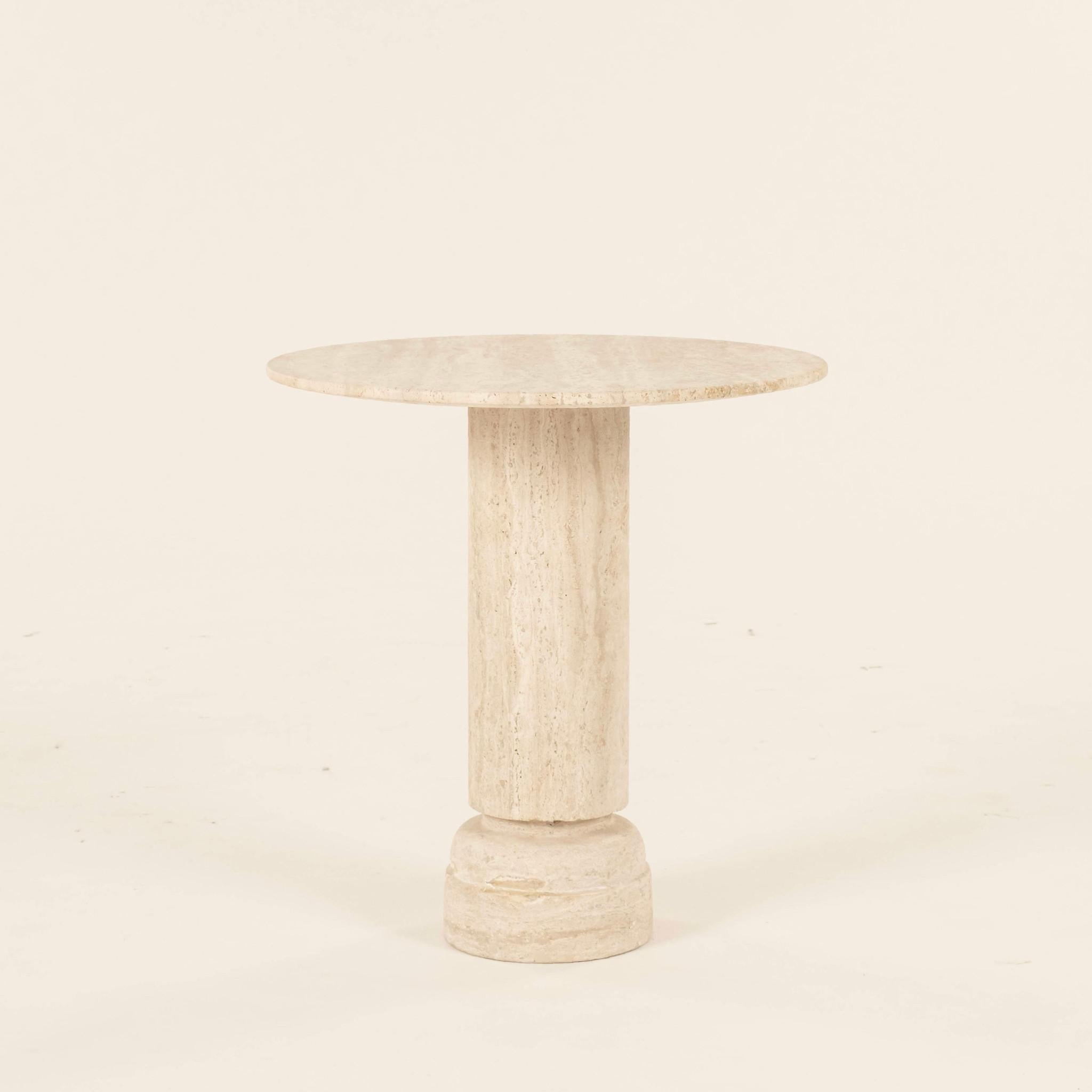 Honed travertine occasional side table with column base.