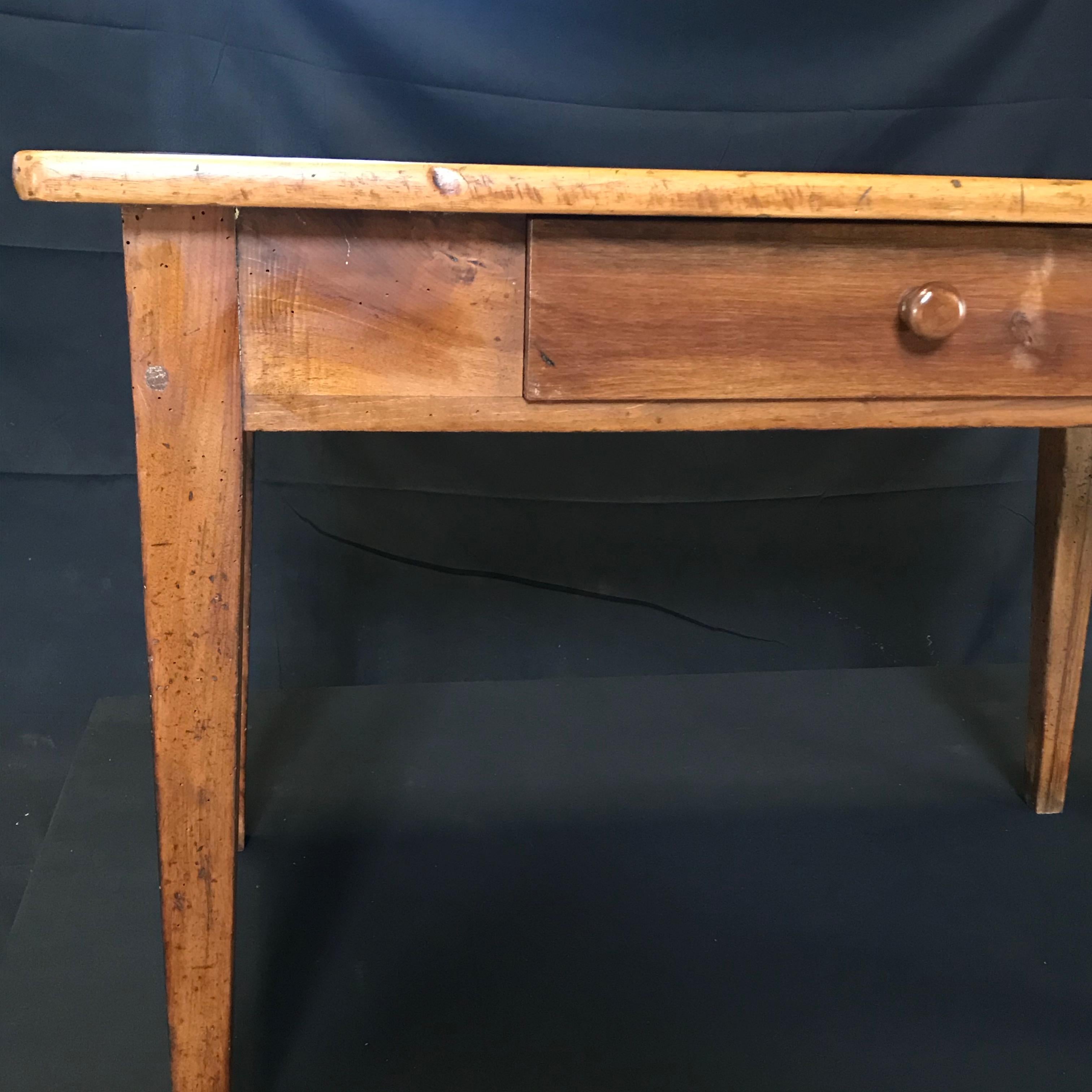 Beautiful country French table that is versatile: can be a side table or desk. Simple, classic Provence style with single drawer and simple tapered legs. Apron 22.5 h
#4391

