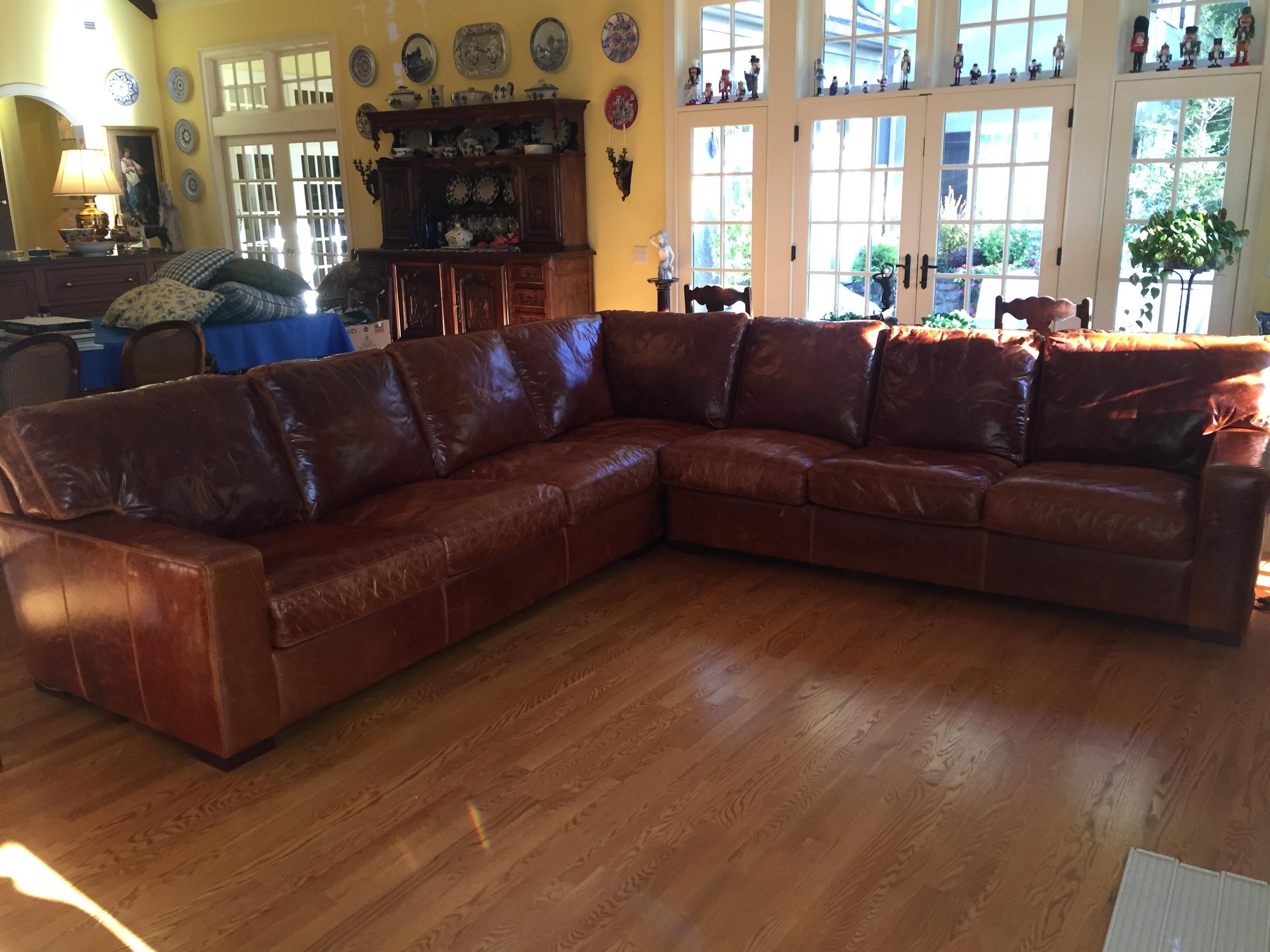 All leather sectional in three parts American made by American Leather Co. two sections are 84 inches long with a corner section of 41 by 41 inches. The total length is 125 inches on each side. The sections are held together with a locking mechanism