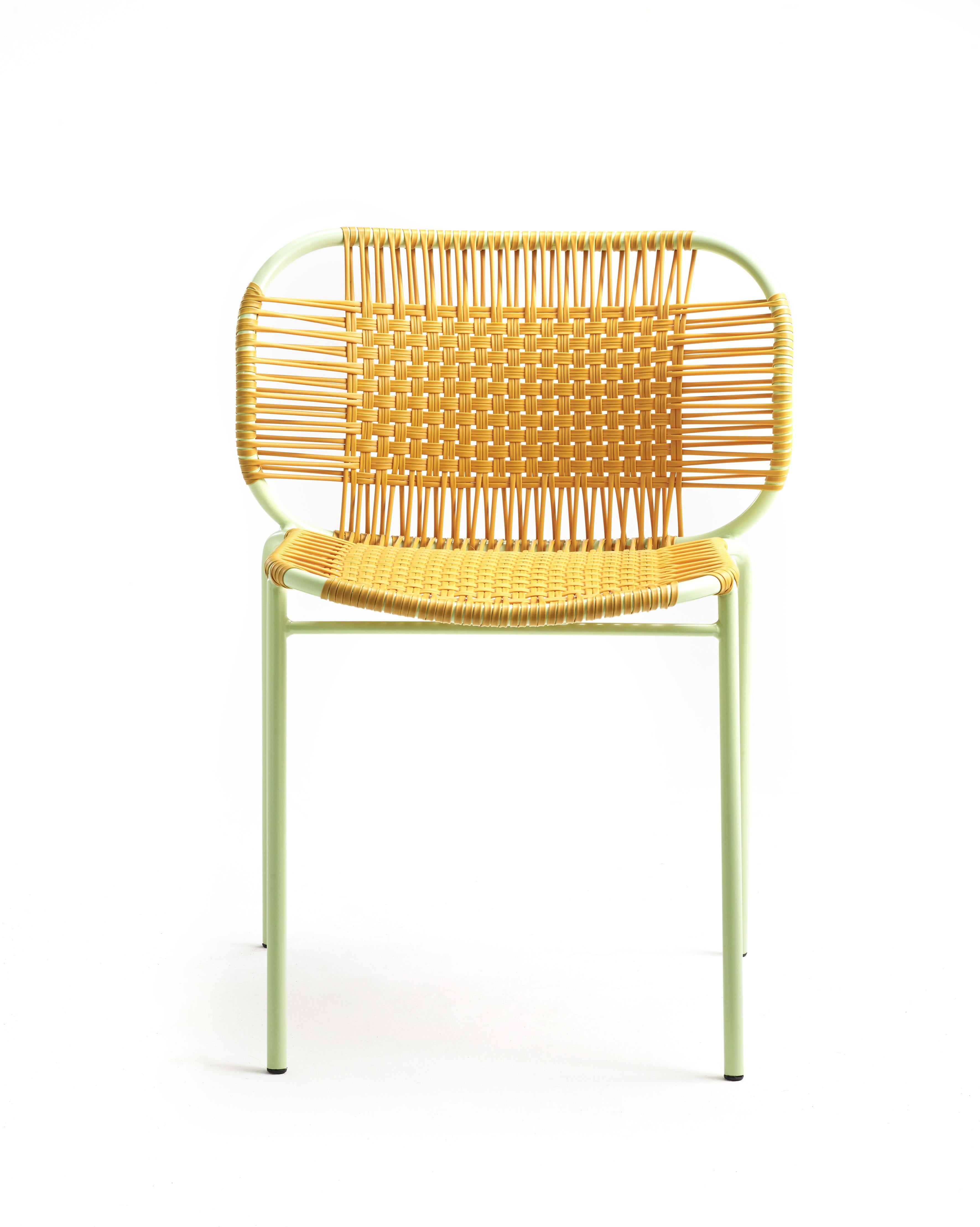 Honey Cielo stacking chair by Sebastian Herkner
Materials: PVC strings, powder-coated steel frame. 
Technique: Made from recycled plastic and weaved by local craftspeople in Cartagena, Colombia. 
Dimensions: W 56 x D 51.4 x H 78 cm 
Also